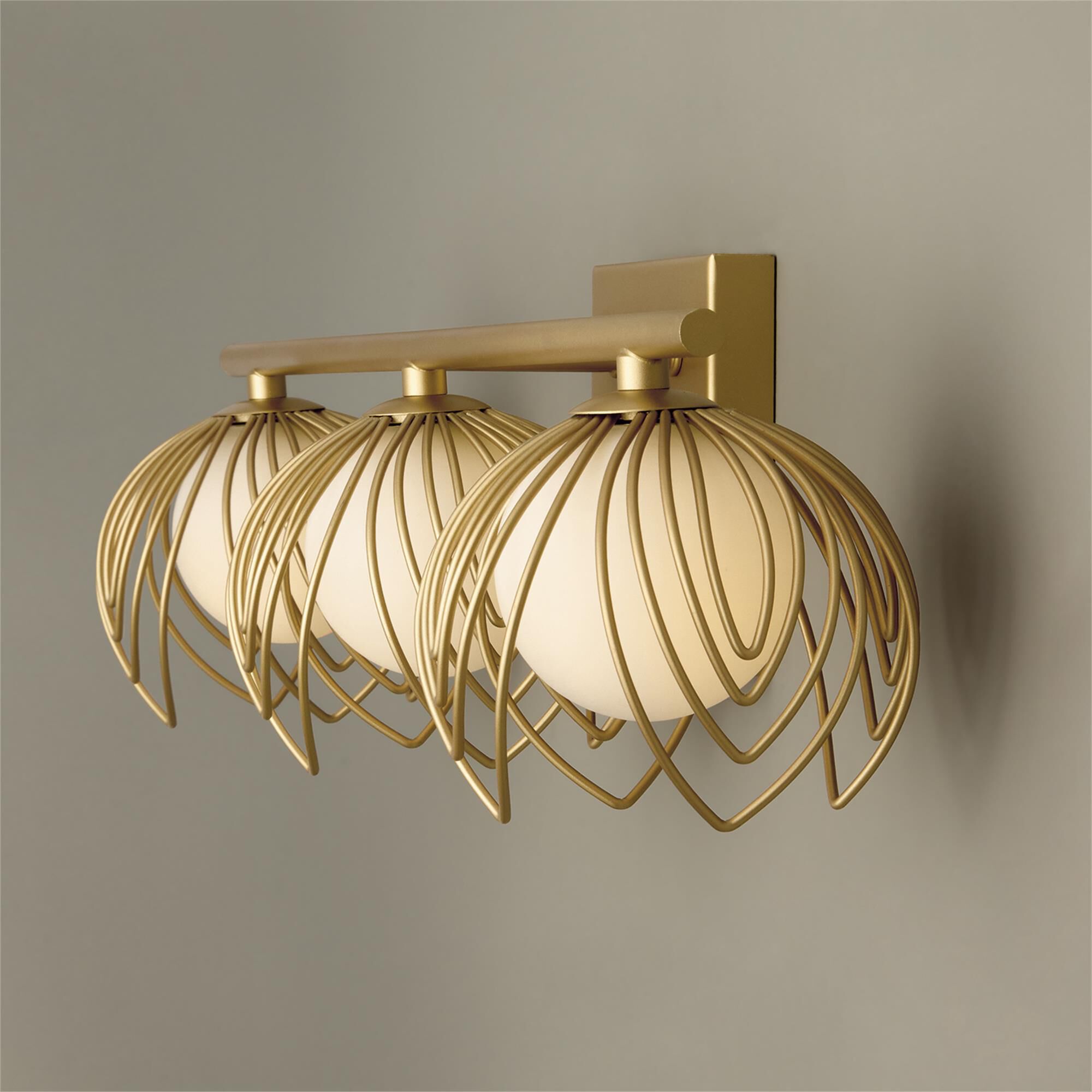 Shown in Buffed Gold finish and Soft White Globes glass