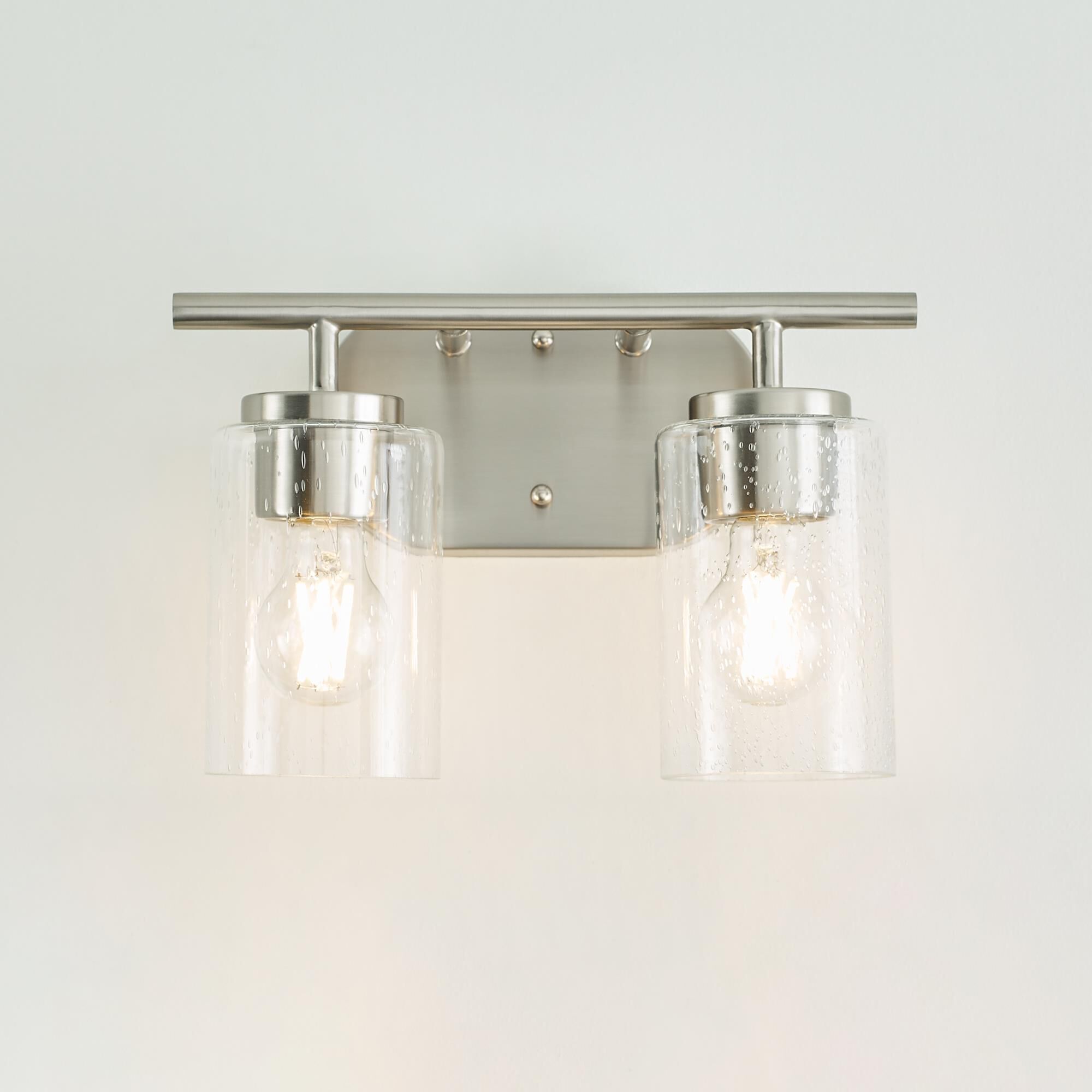 Shown in Brushed Nickel finish and Clear Seeded glass