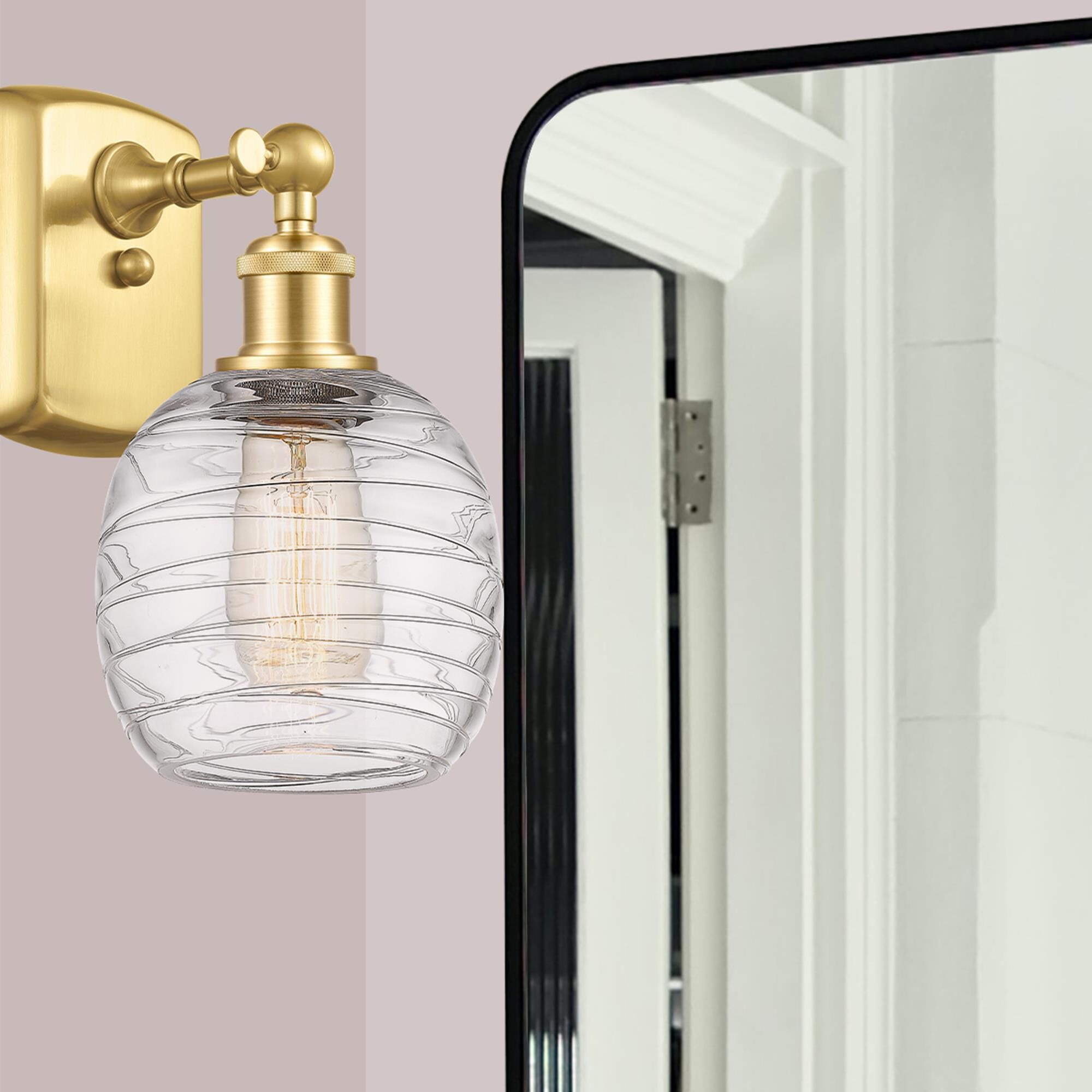 Shown in Satin Gold finish and Deco Swirl glass