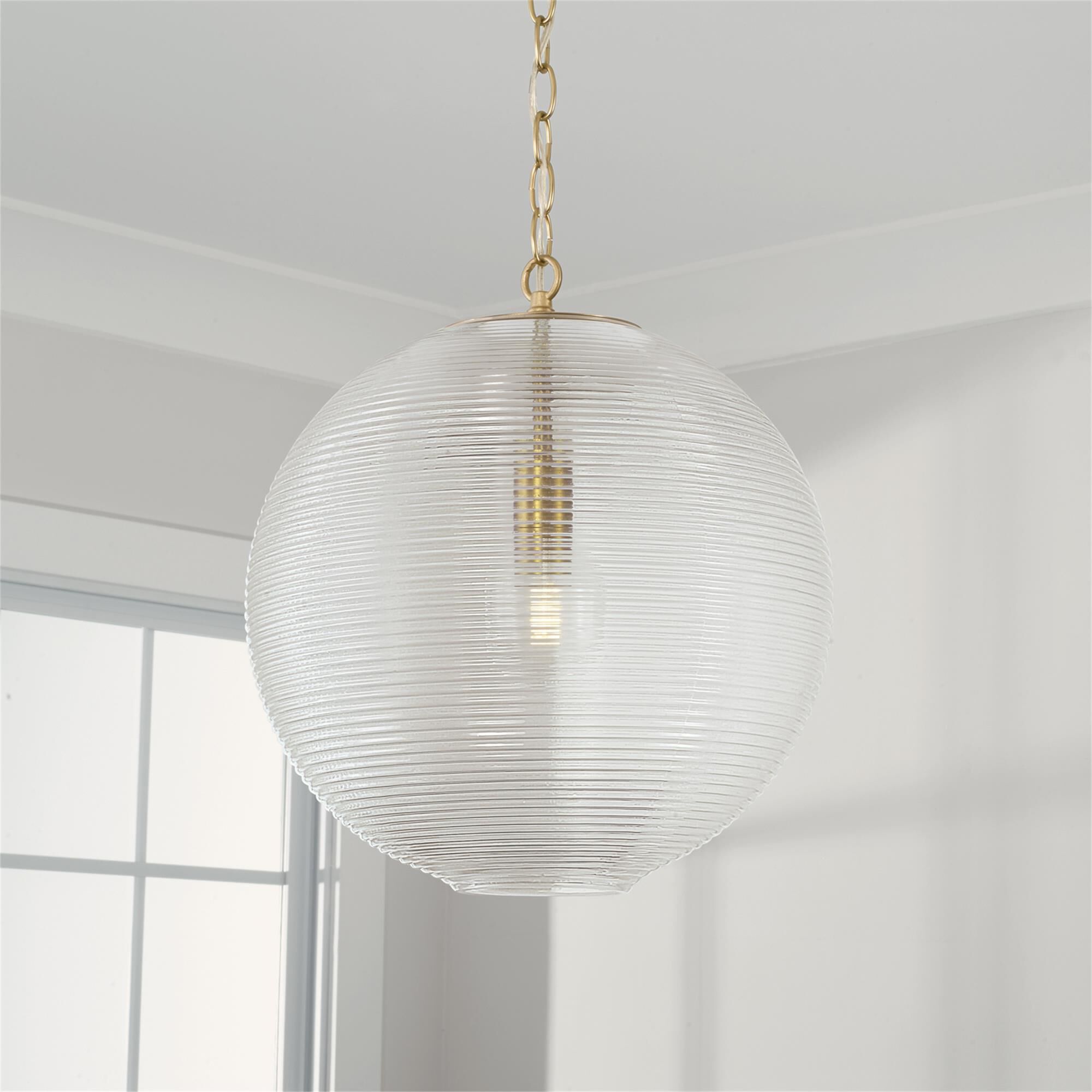Shown in Matte Brass finish and Clear Ribbed glass