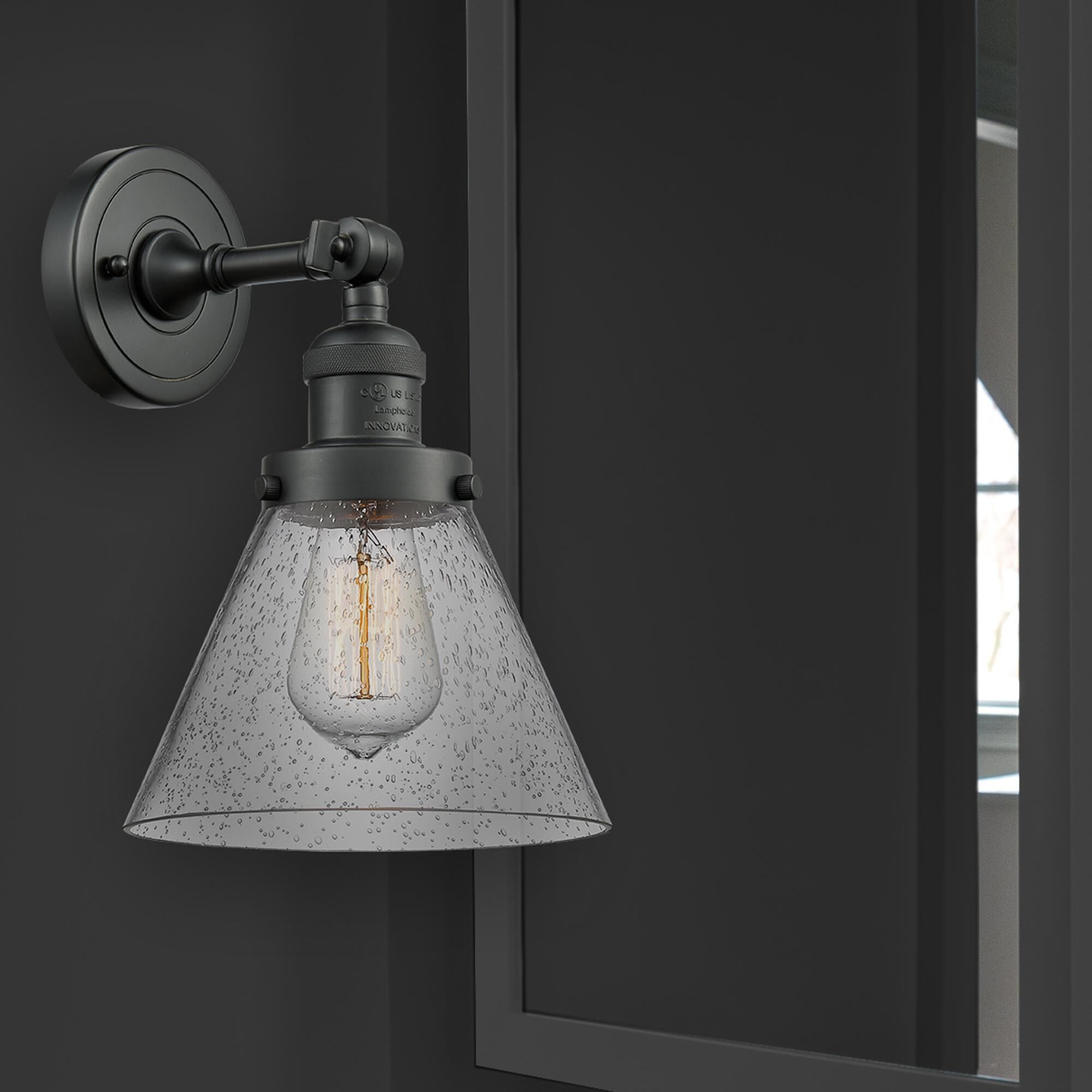 Shown in Matte Black finish and Seedy glass and Brushed Satin Nickel shade and No Accent accent