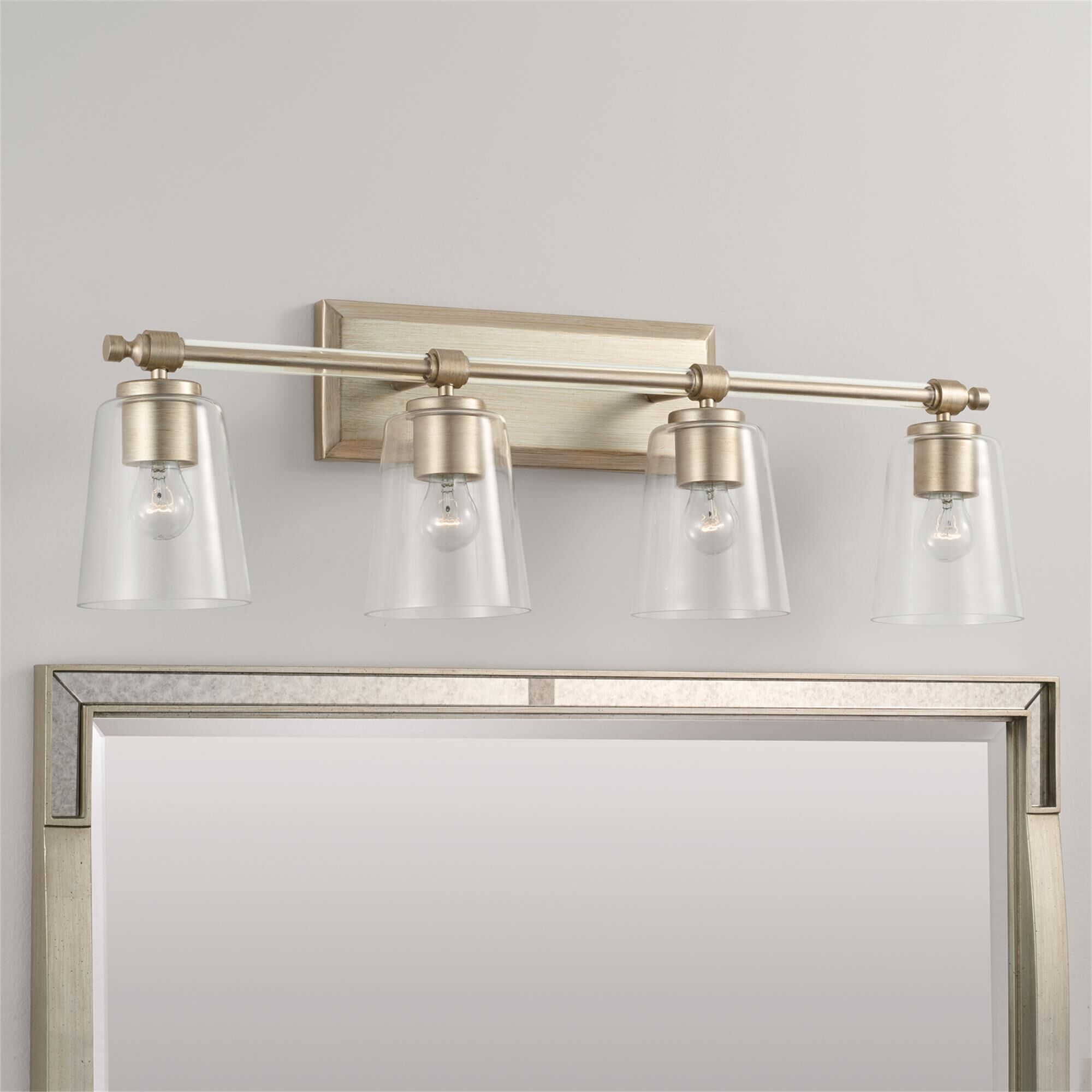 Shown in Brushed Champagne finish and Clear glass