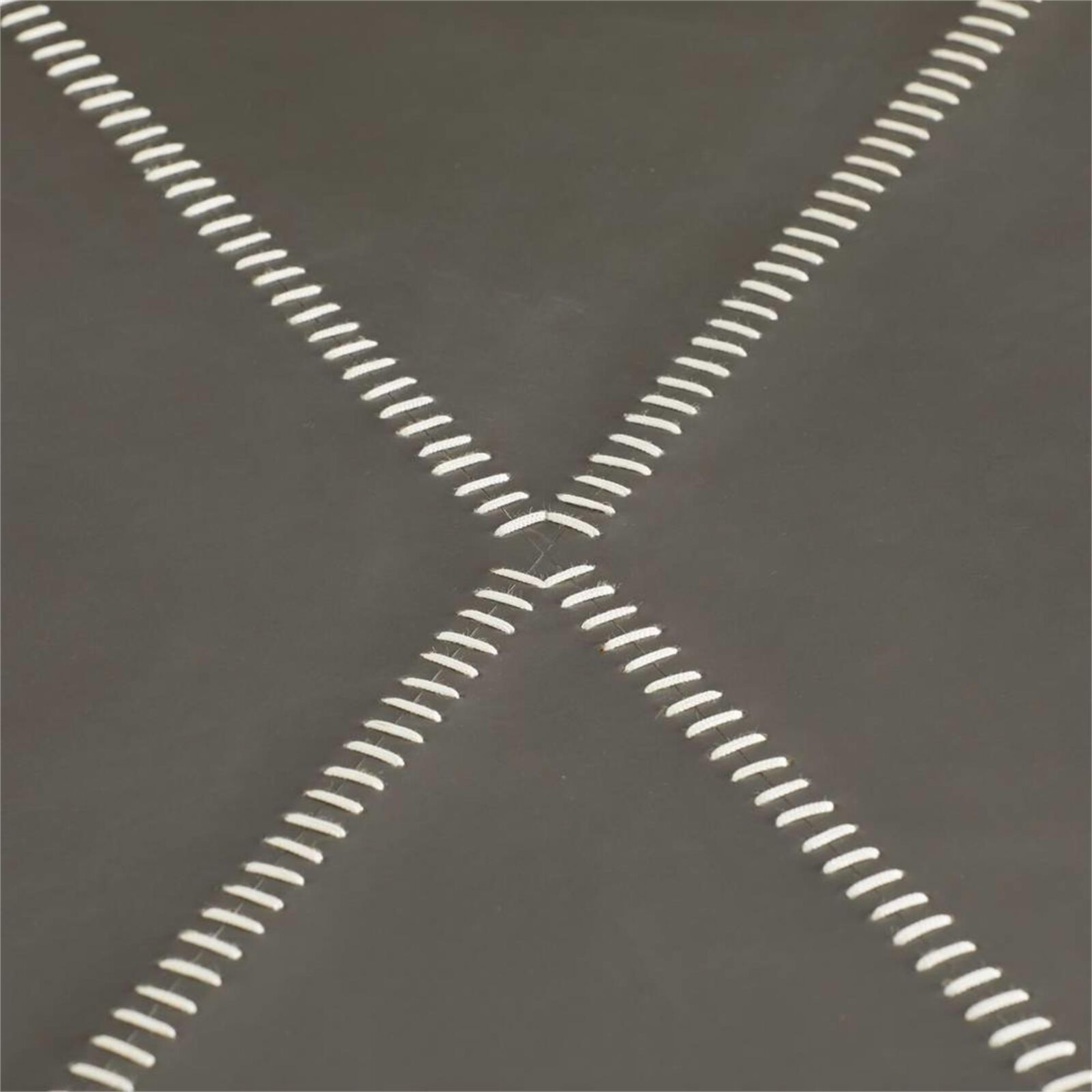Close-up of the X-shaped stitching on the tabletop