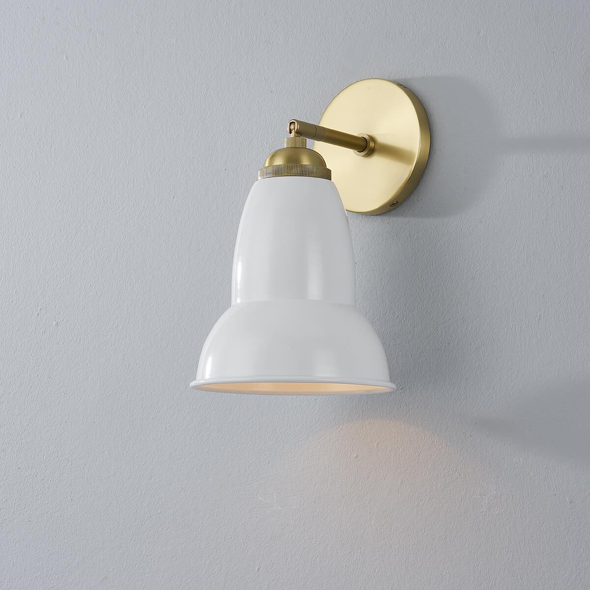 Shown in Aged Brass finish and Glossy White Metal shade