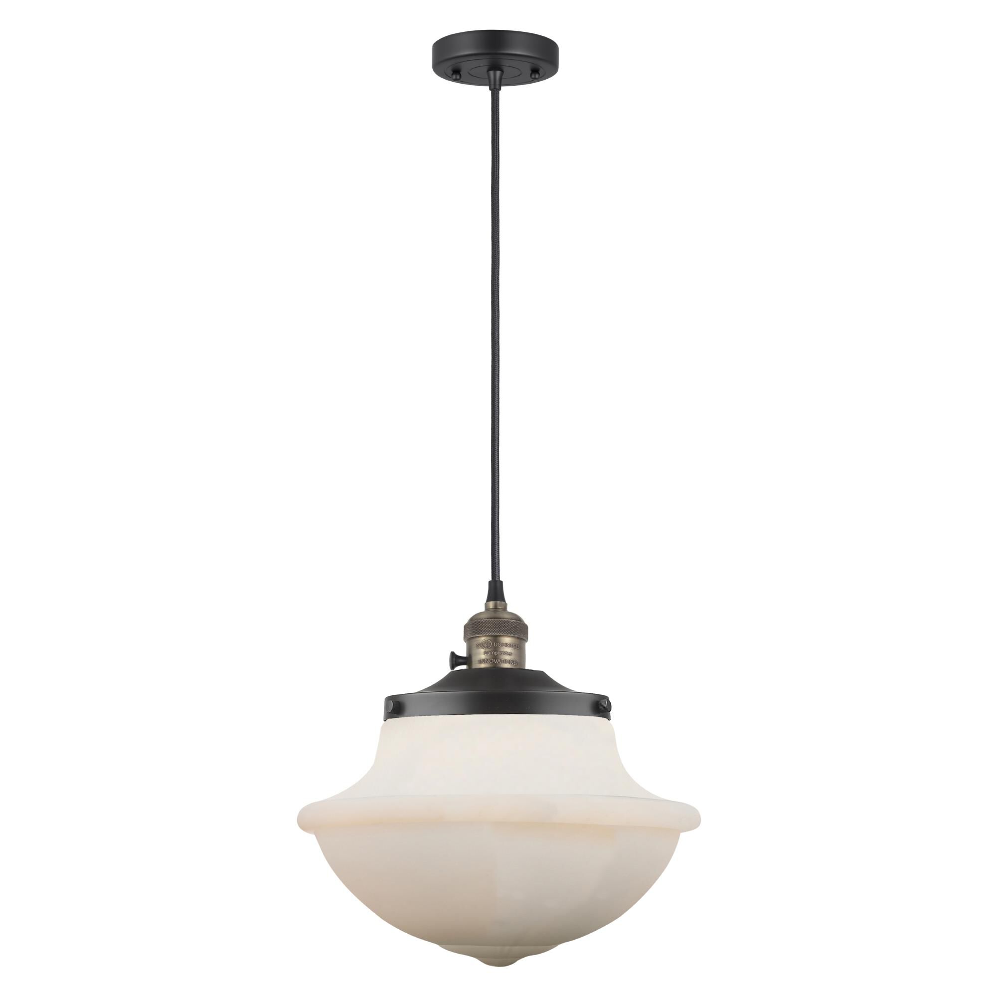 Shown in Black Antique Brass finish and Matte White Cased glass