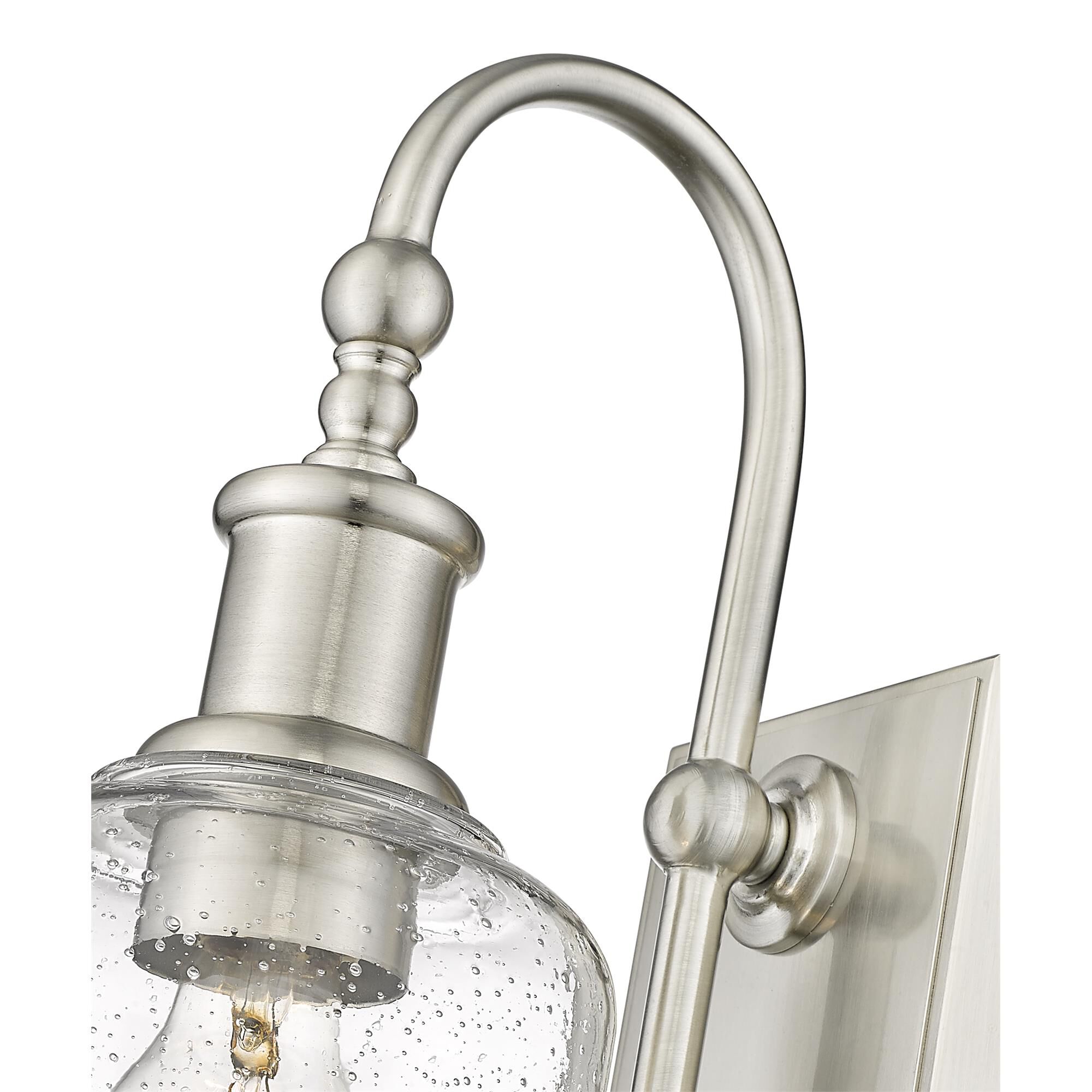 Shown in Brushed Nickel finish and Glass shade