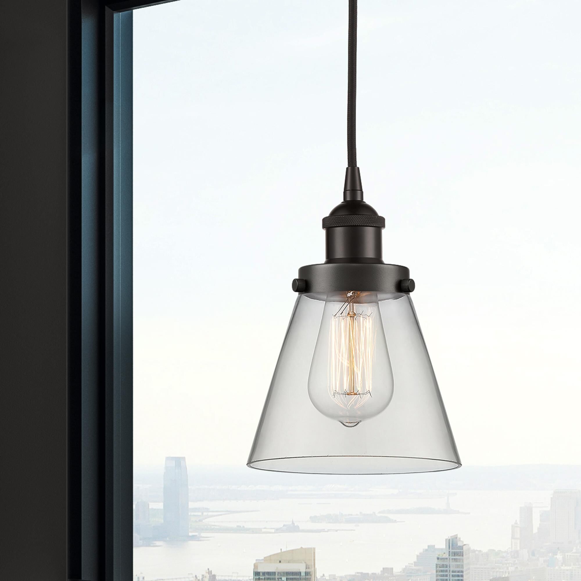 Shown in Oil Rubbed Bronze finish and Clear Small Cone glass