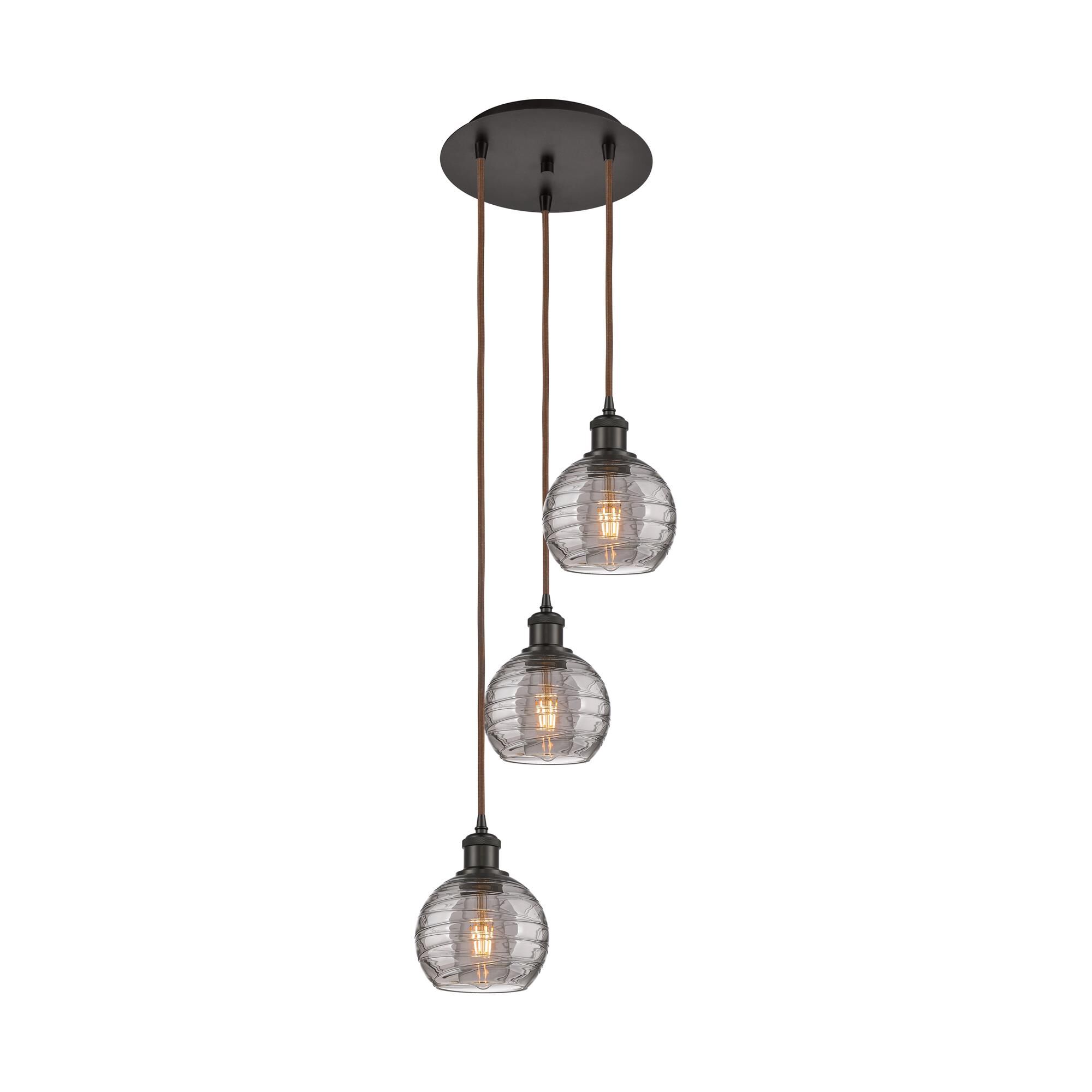 Shown in Oil Rubbed Bronze finish and Light Smoke Deco Swirl glass