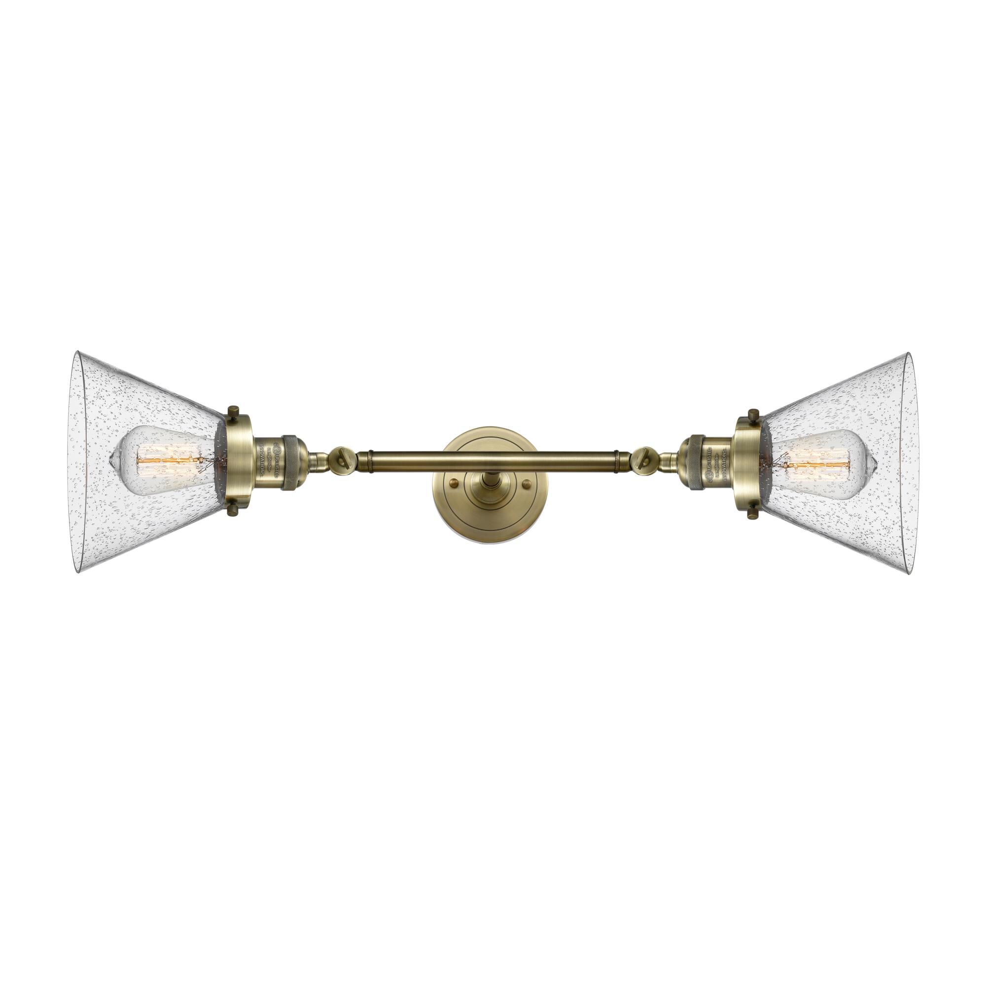 Shown in Antique Brass finish and Seedy glass