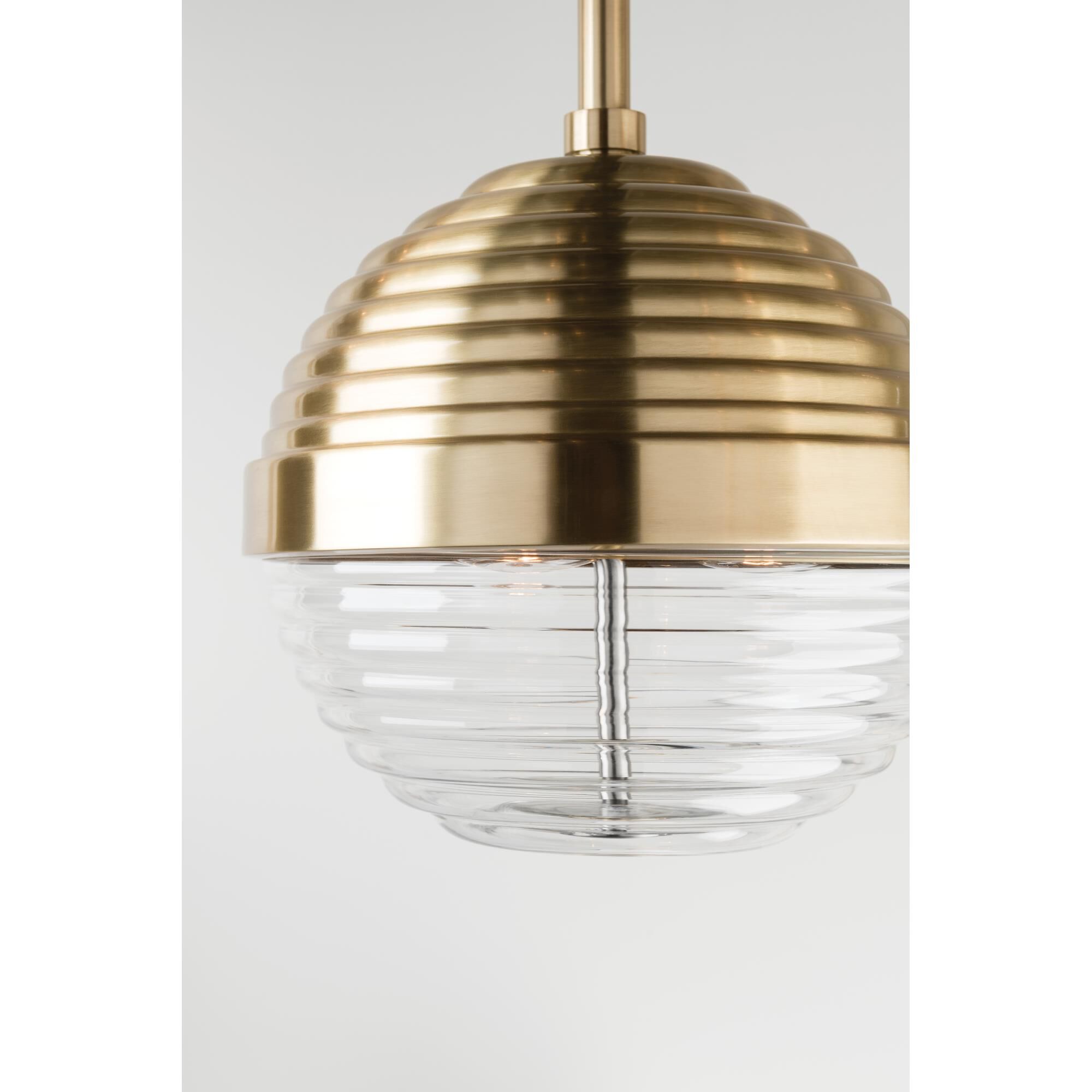 Shown in Aged Brass finish and Clear glass