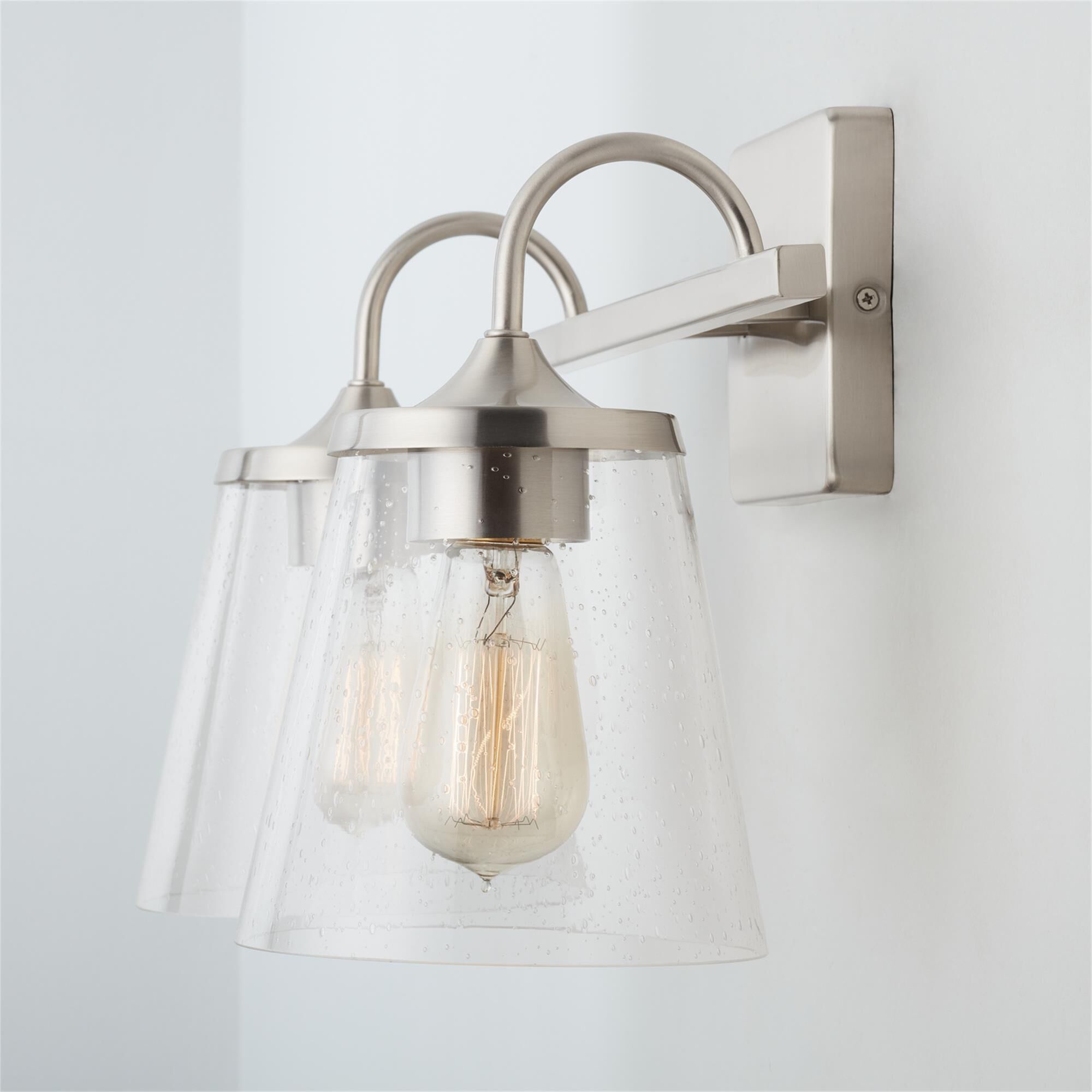Shown in Brushed Nickel finish and Clear Seeded glass