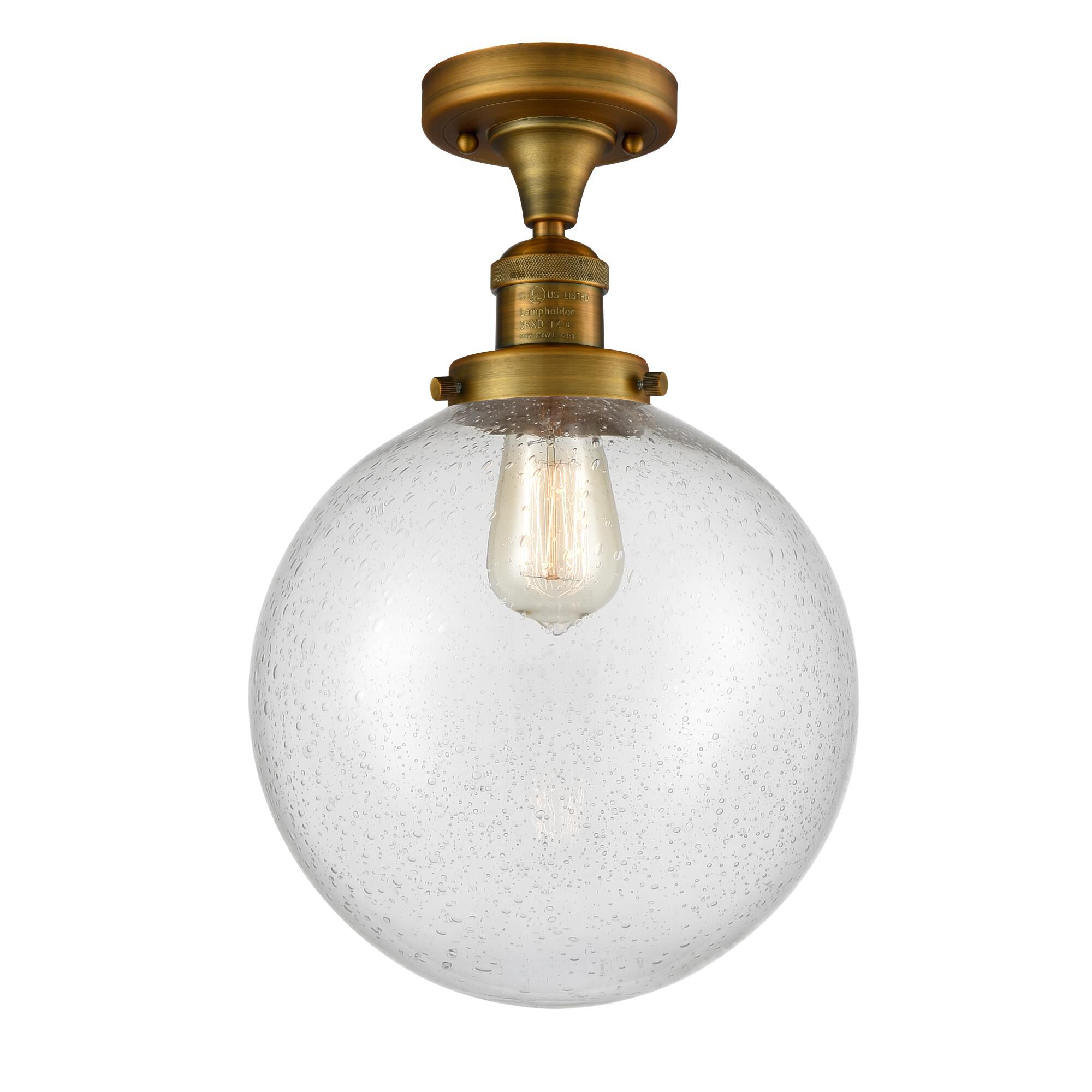 Shown in Brushed Brass finish and Seedy glass