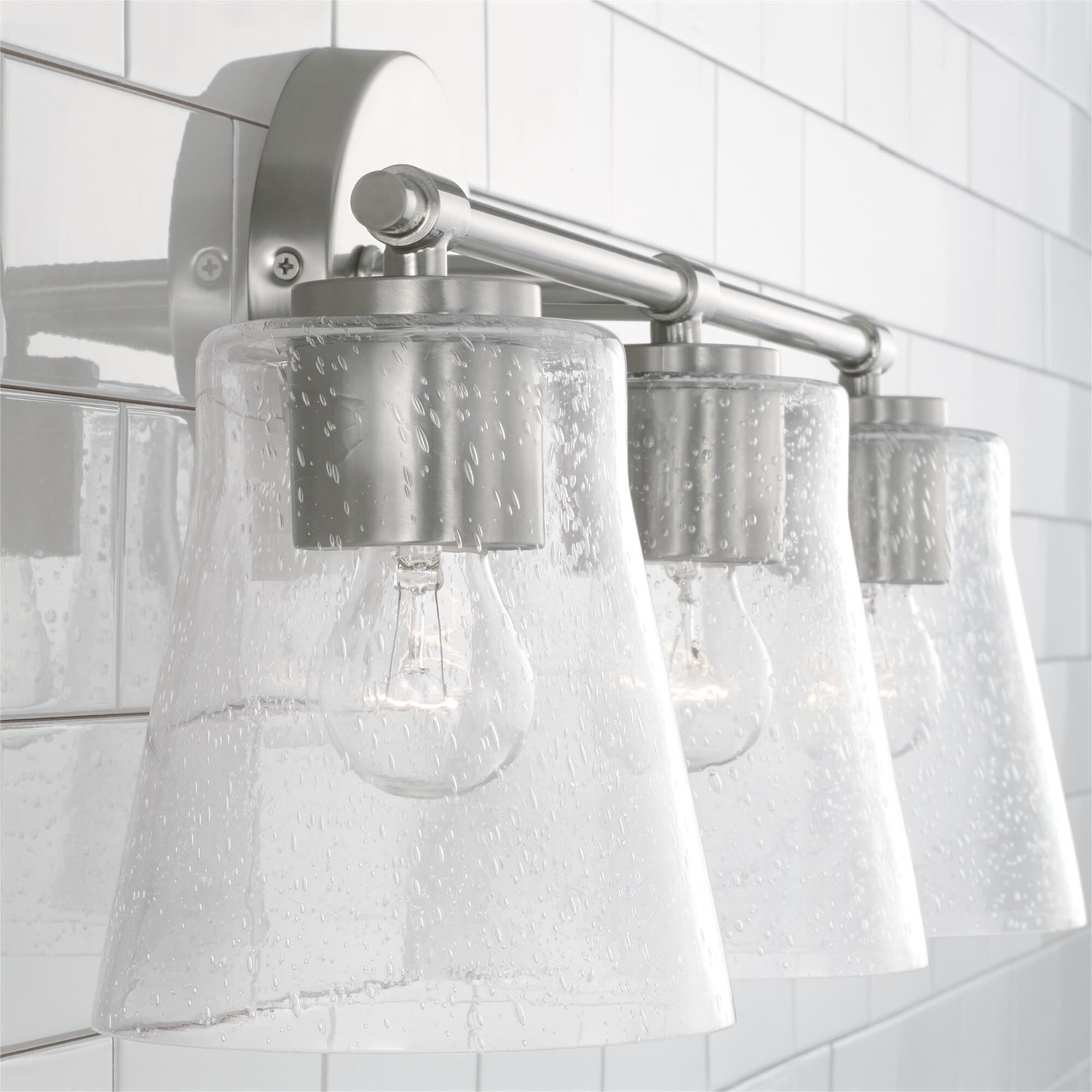 Shown in Brushed Nickel finish and Clear Seeded glass