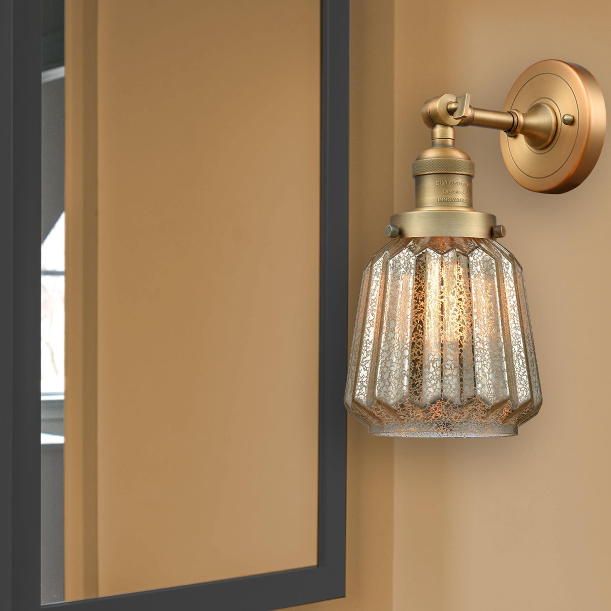 Shown in Brushed Brass finish and Mercury Fluted glass