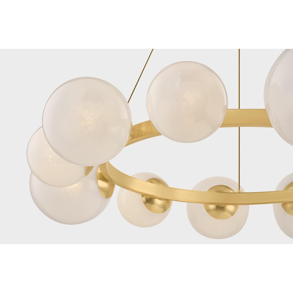 Shown in Aged Brass finish and Seeded Cloud glass