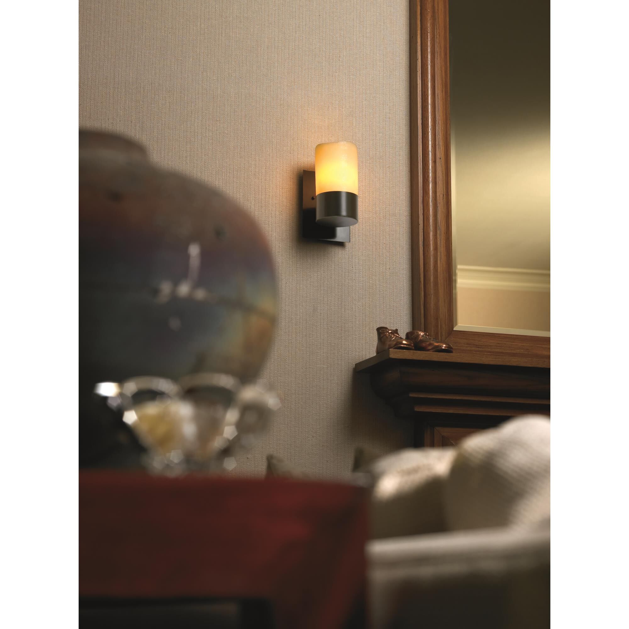 Shown in Dark Bronze finish and Amber Faux Candle Resin glass and Cylinder with Melted Rim accent