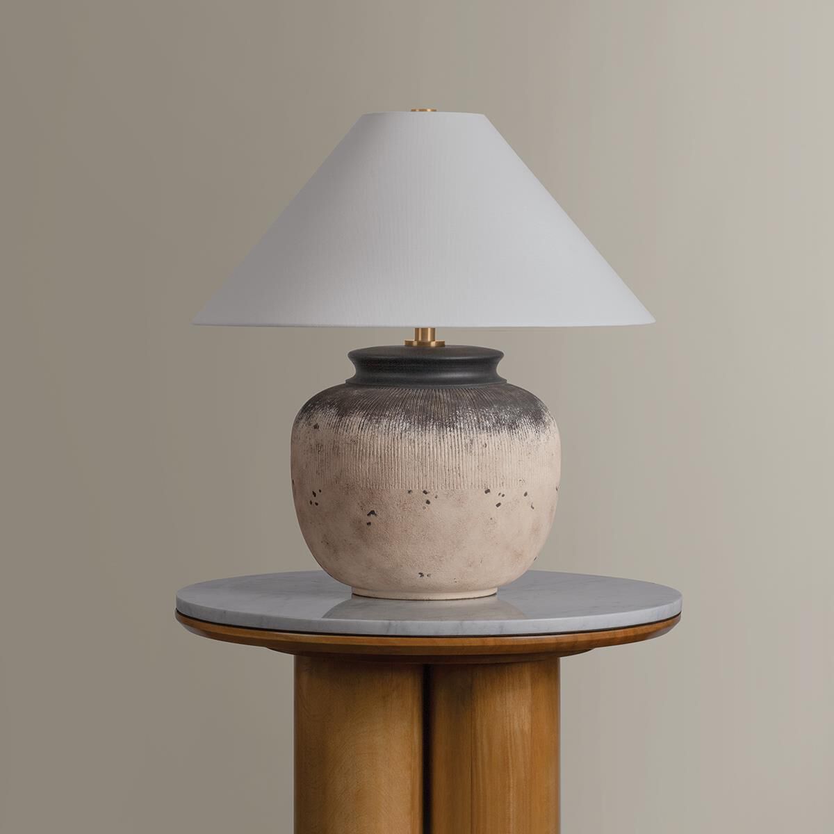 Shown in Patina Brass and Ceramic Flamed White finish and Off White Linen shade