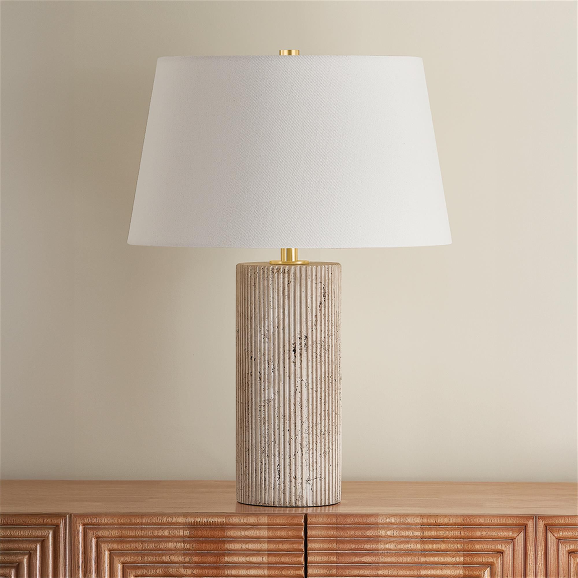 Shown in Aged Brass finish and Off White Linen shade