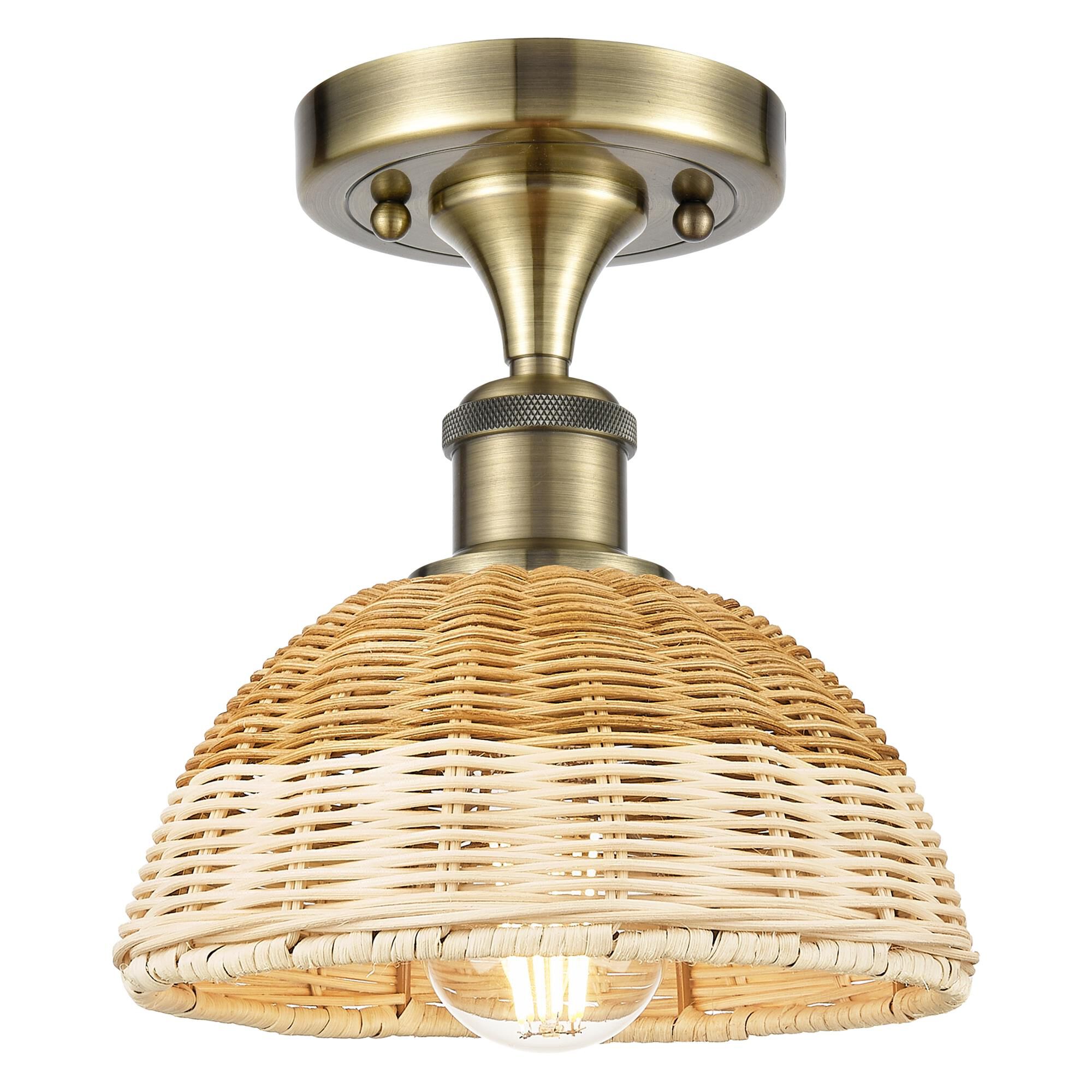 Shown in Antique Brass finish and Natural shade