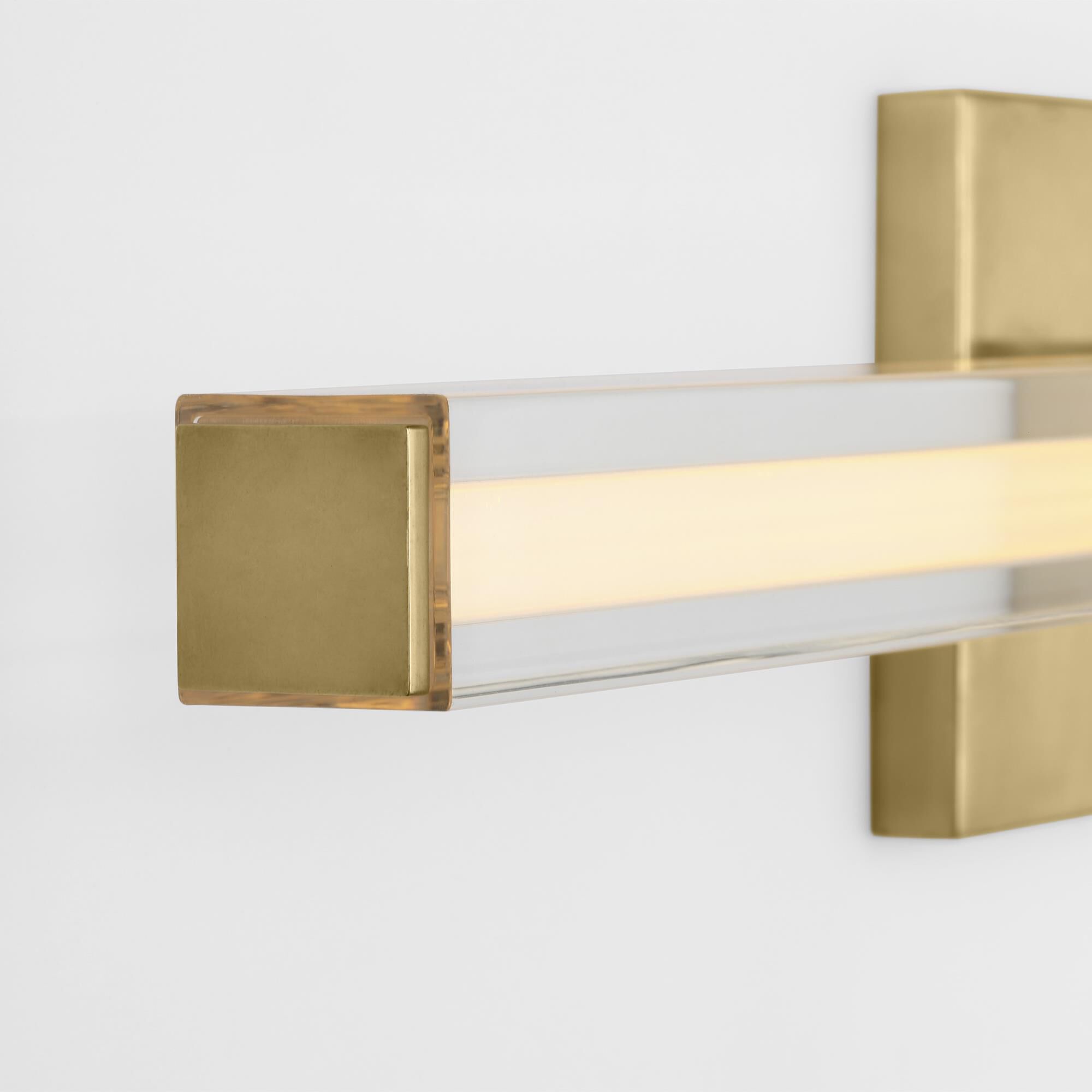 Shown in Hand-Rubbed Antique Brass finish and Clear Acrylic glass