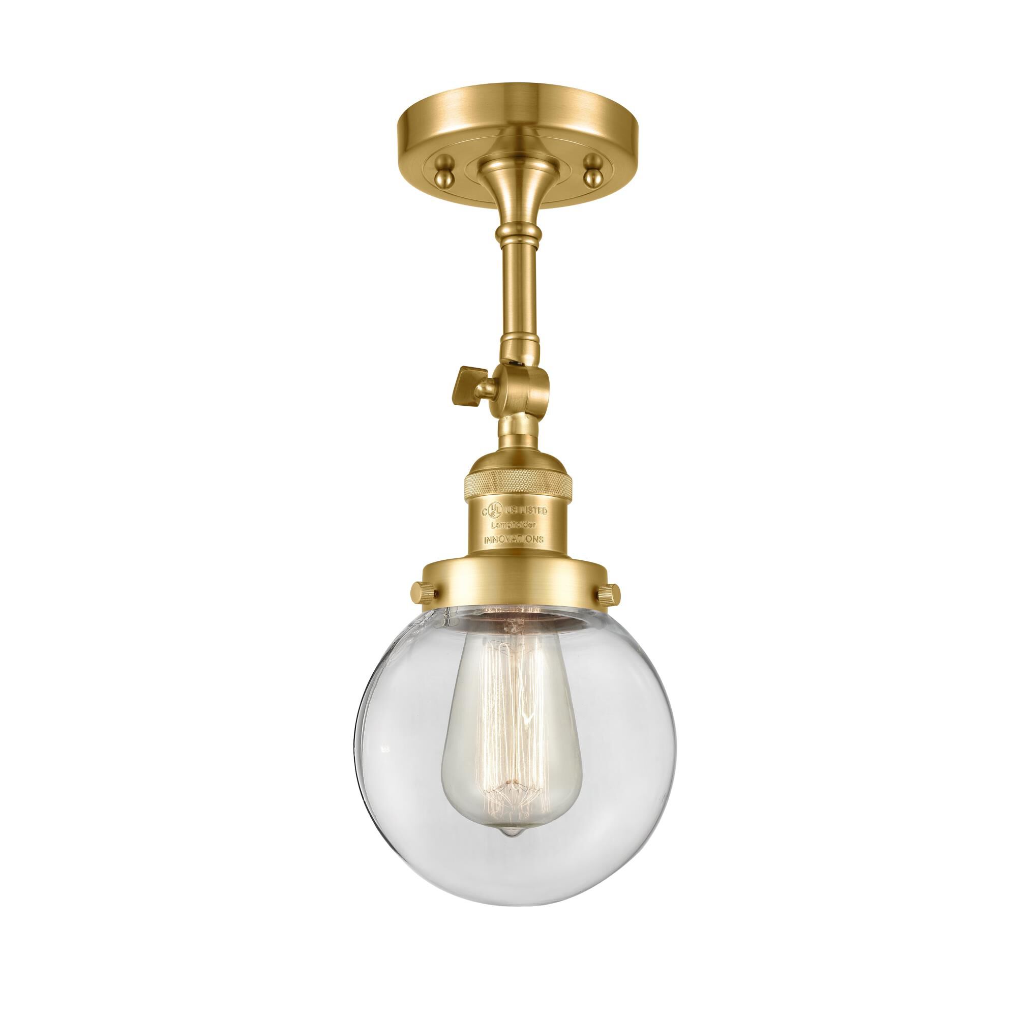 Shown in Satin Gold finish and Clear Beacon glass