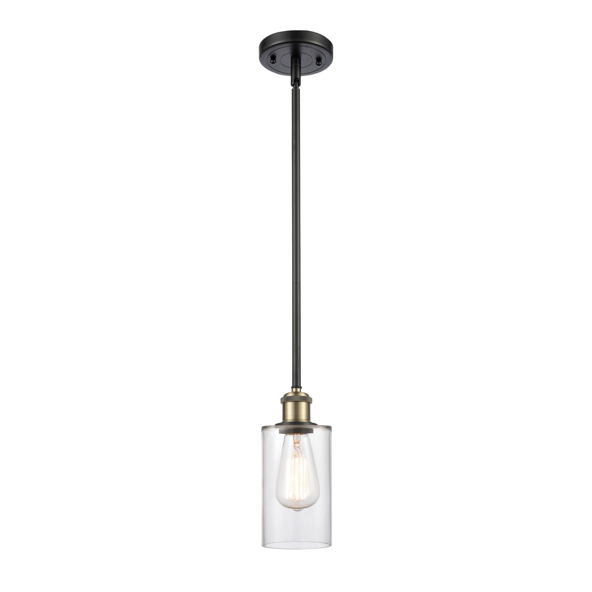 Shown in Black Antique Brass finish and Drum glass and Glass shade