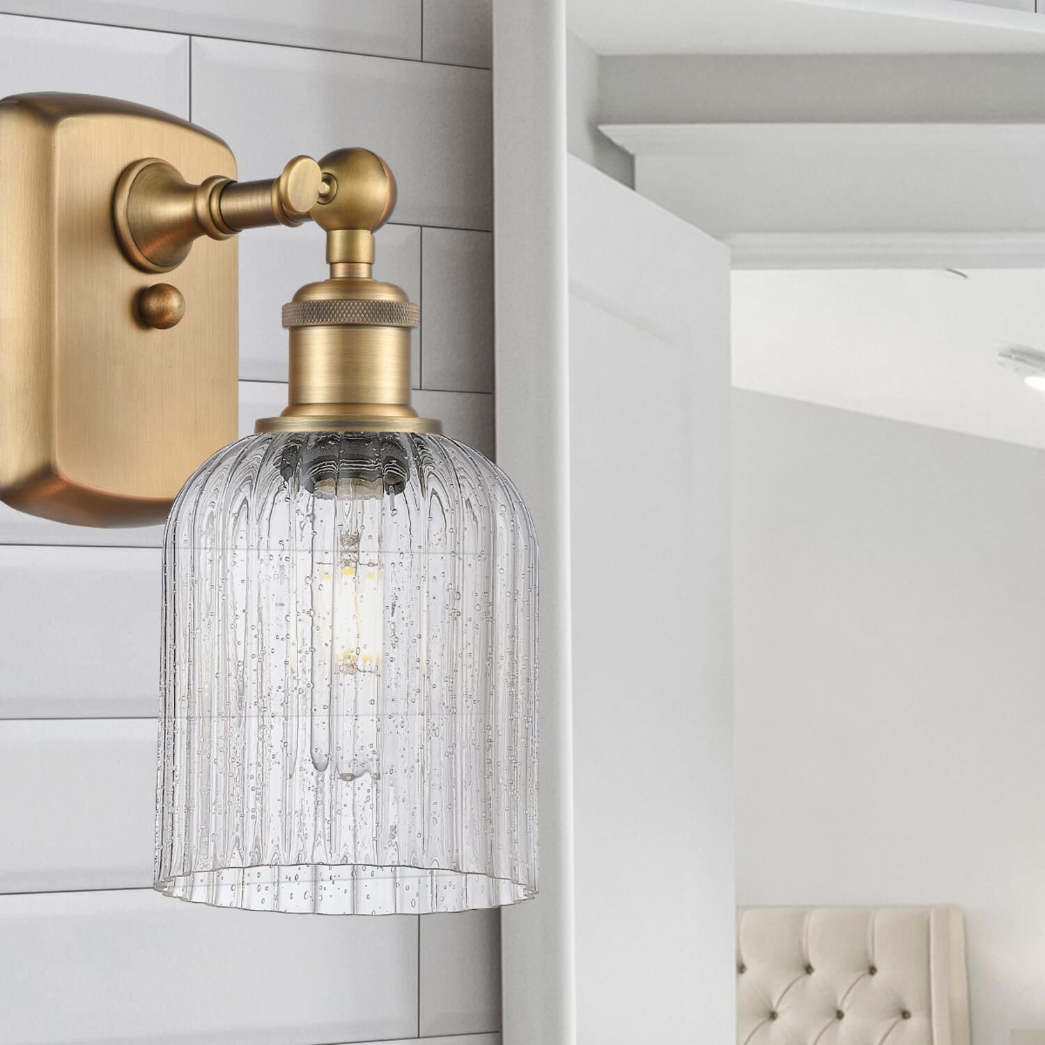 Shown in Brushed Brass finish and Seedy glass