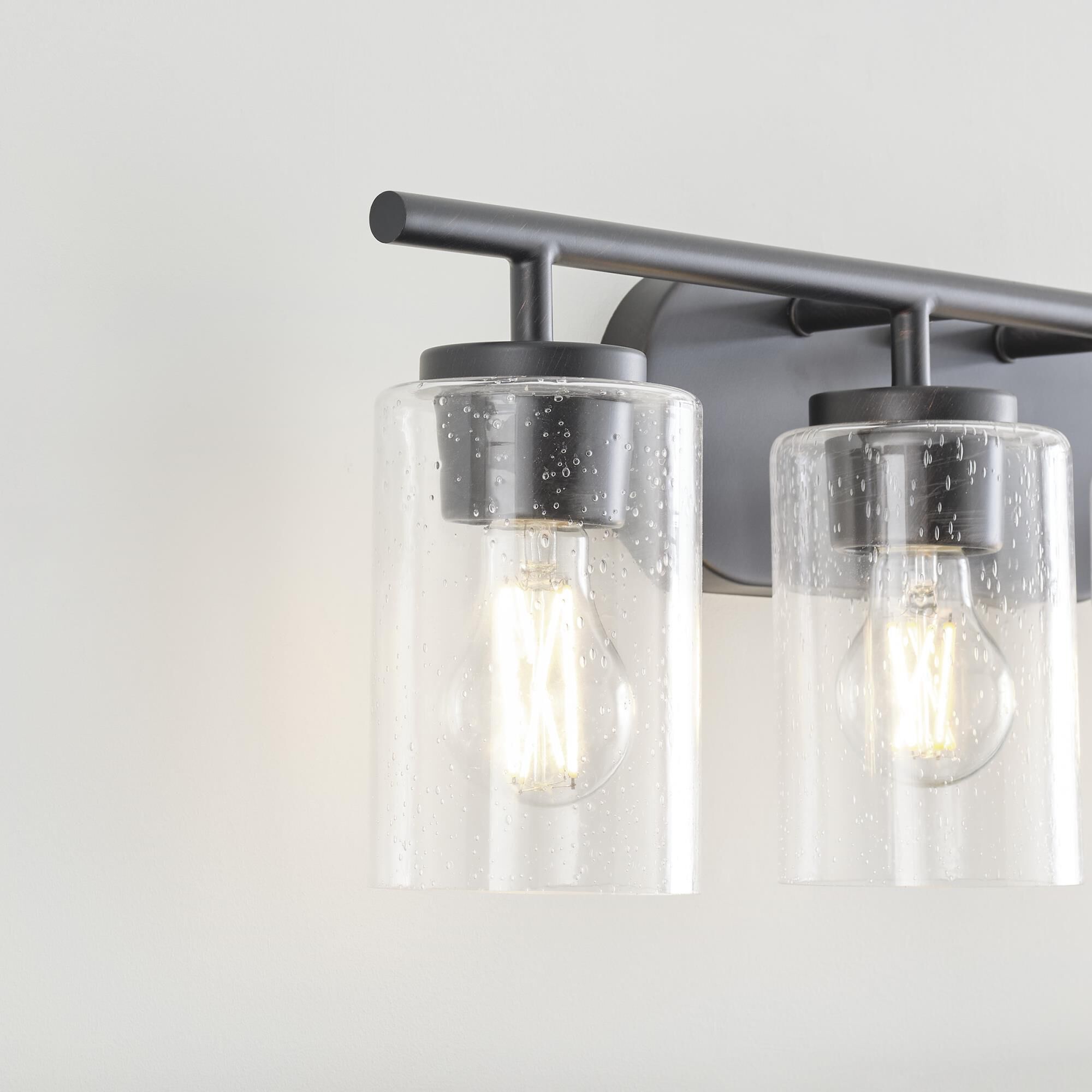 Shown in Bronze finish and Clear Seeded glass