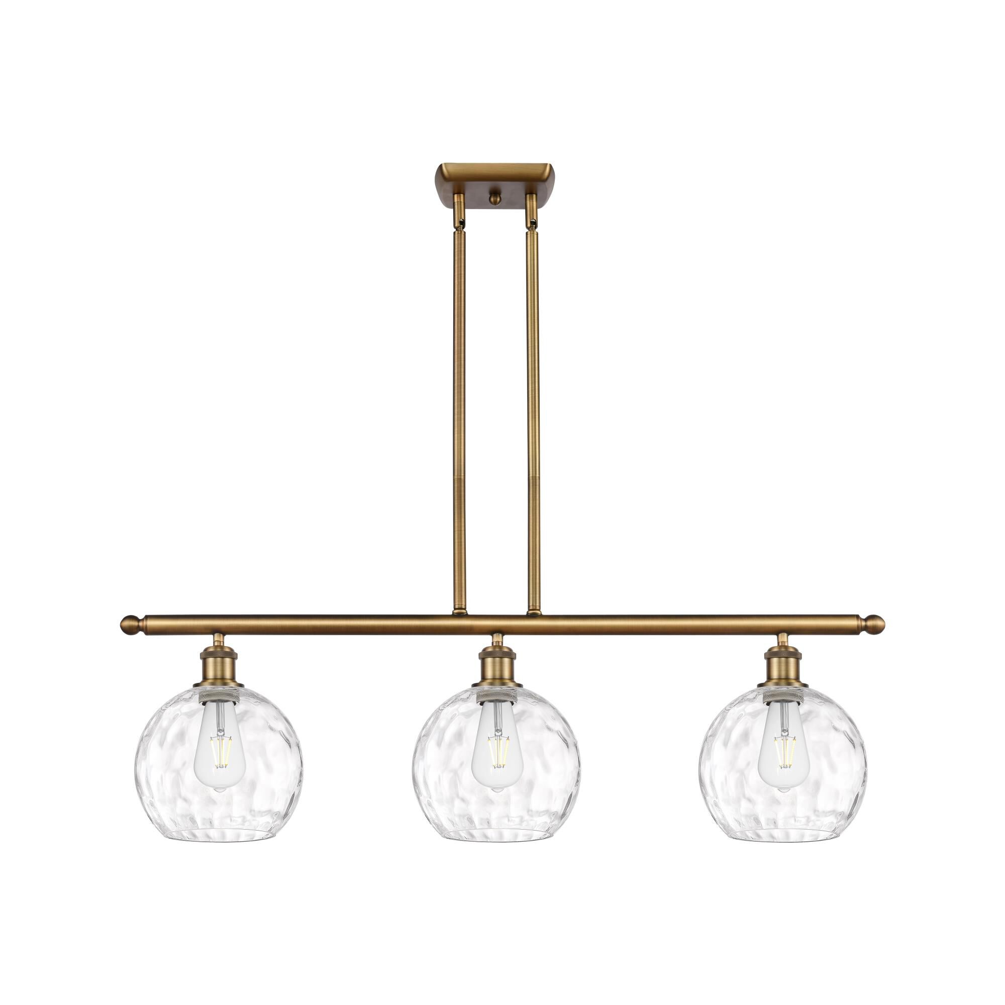 Shown in Brushed Brass finish and Clear glass