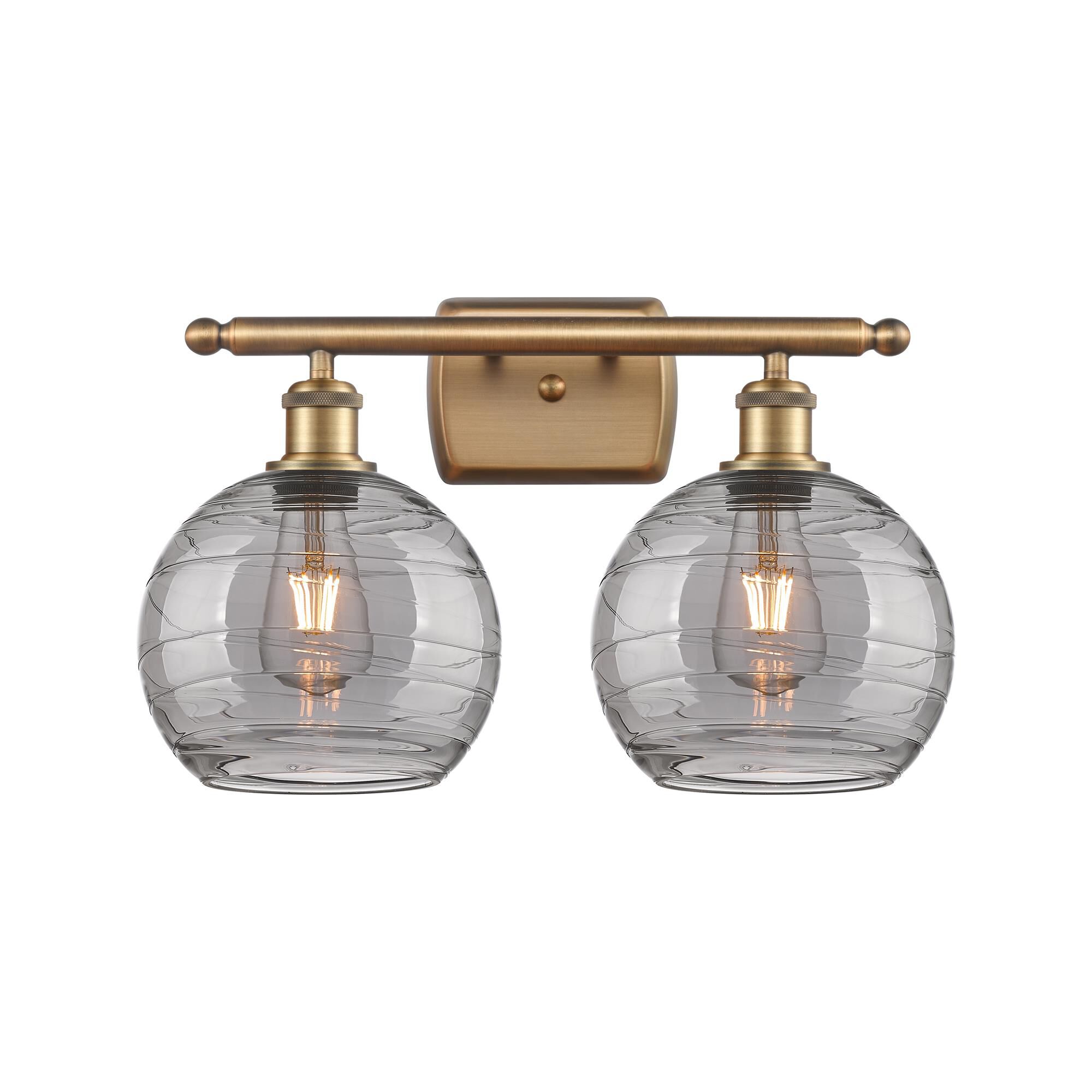 Shown in Brushed Brass finish and Light Smoke Deco Swirl glass
