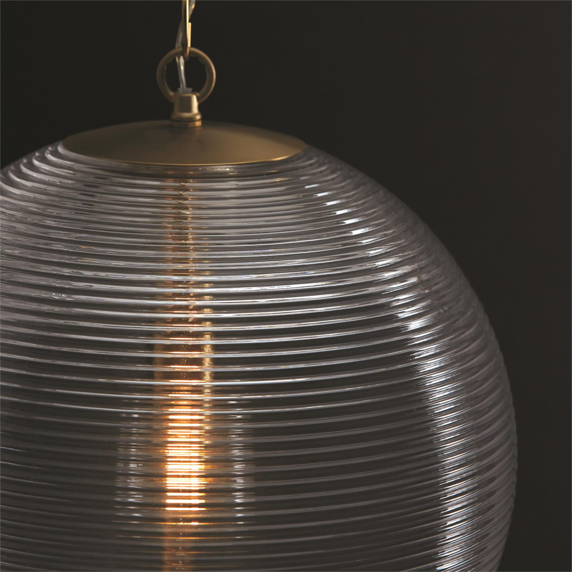Shown in Matte Brass finish and Clear Ribbed glass