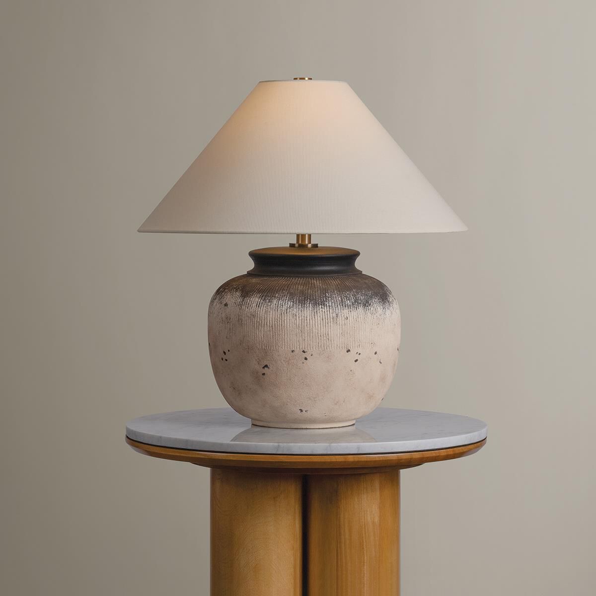 Shown in Patina Brass and Ceramic Flamed White finish and Off White Linen shade