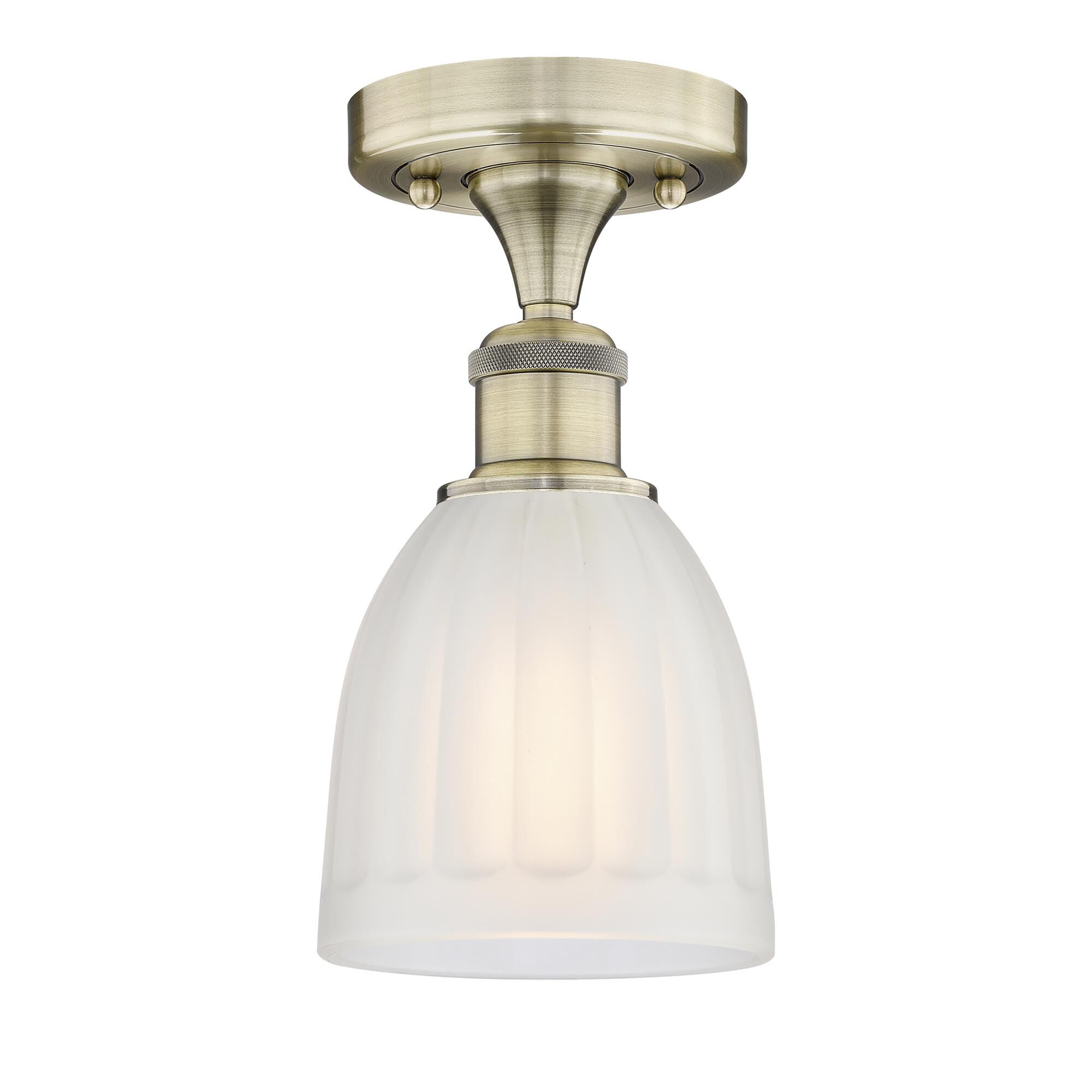 Shown in Antique Brass finish and White glass