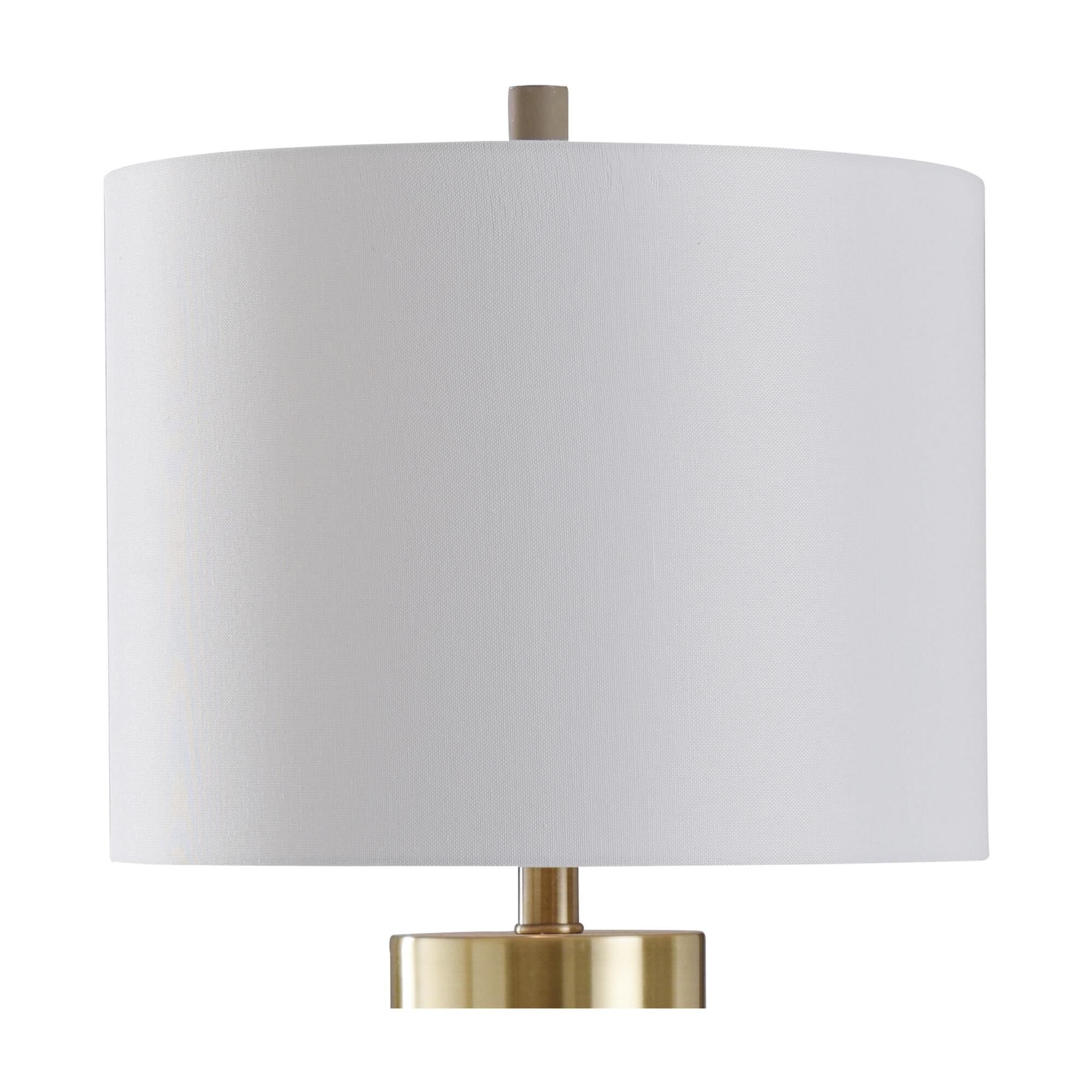 Shown in Soft Brass, Natural Concrete finish and Brussels White Hardback Fabric shade