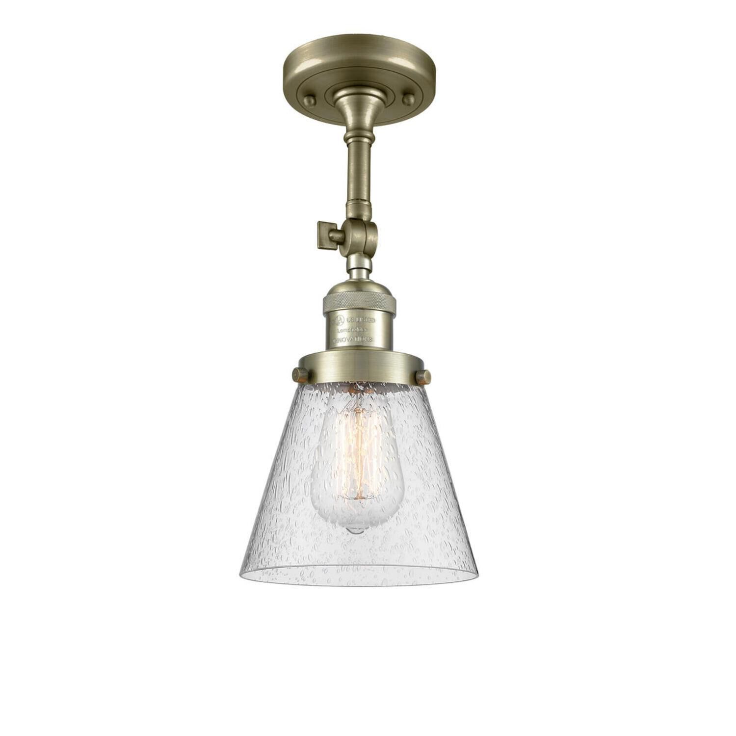 Shown in Antique Brass finish and Seedy glass and None accent