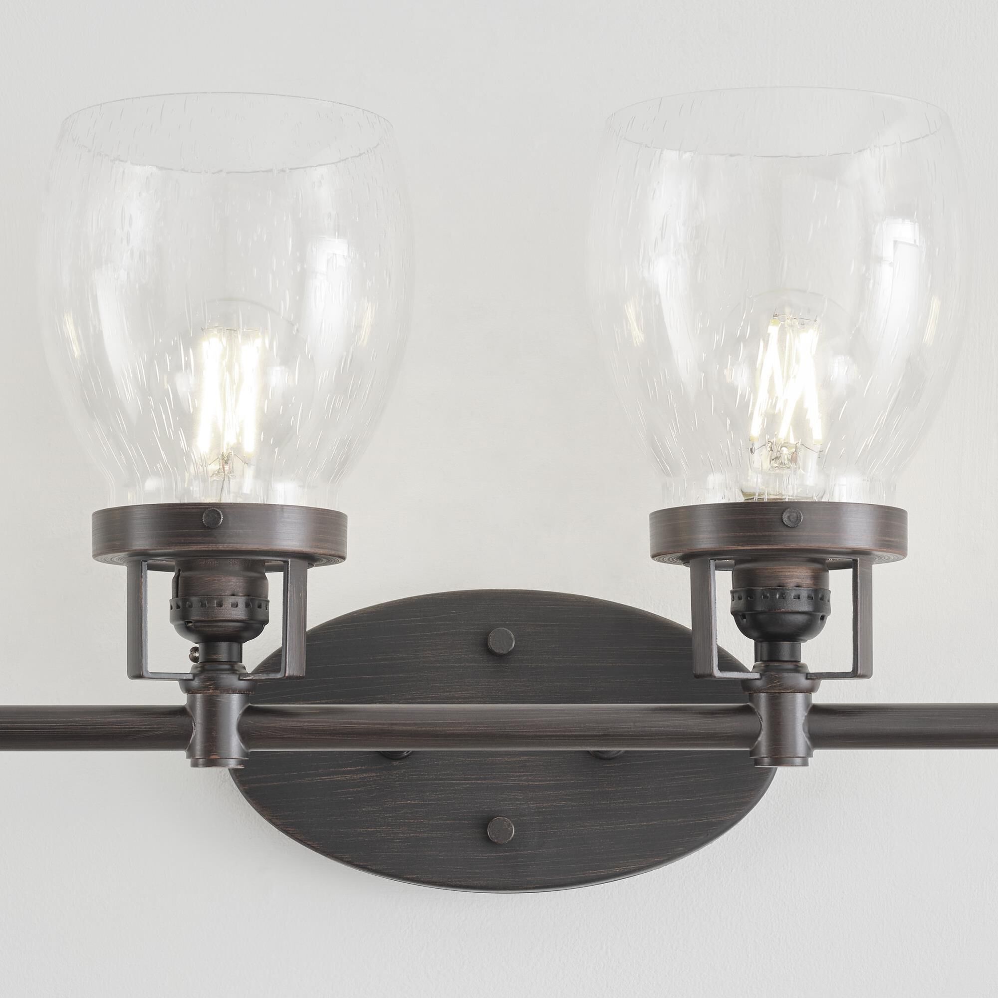 Shown in Bronze finish and Clear Seeded glass