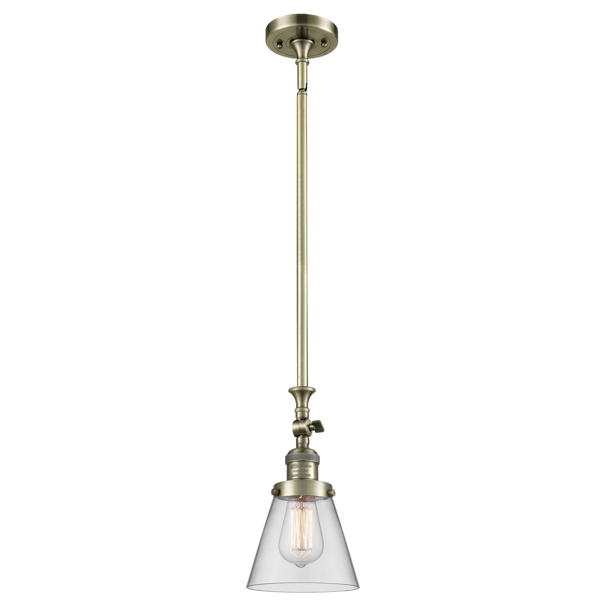 Shown in Antique Brass finish and Clear glass
