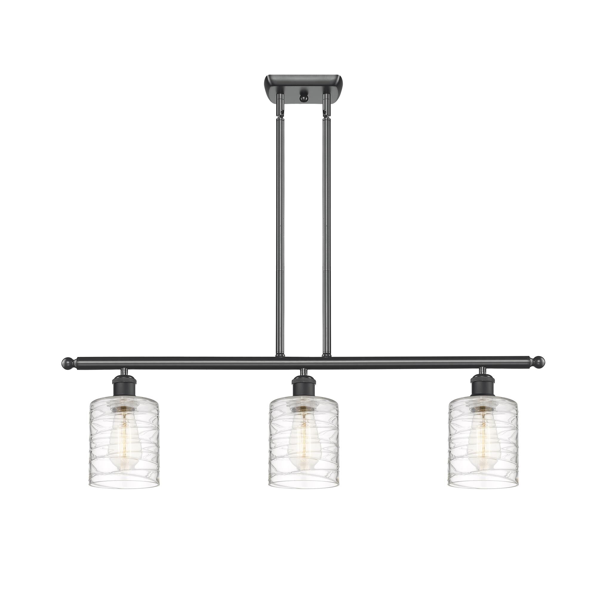 Shown in Matte Black finish and Deco Swirl Cobbleskill glass