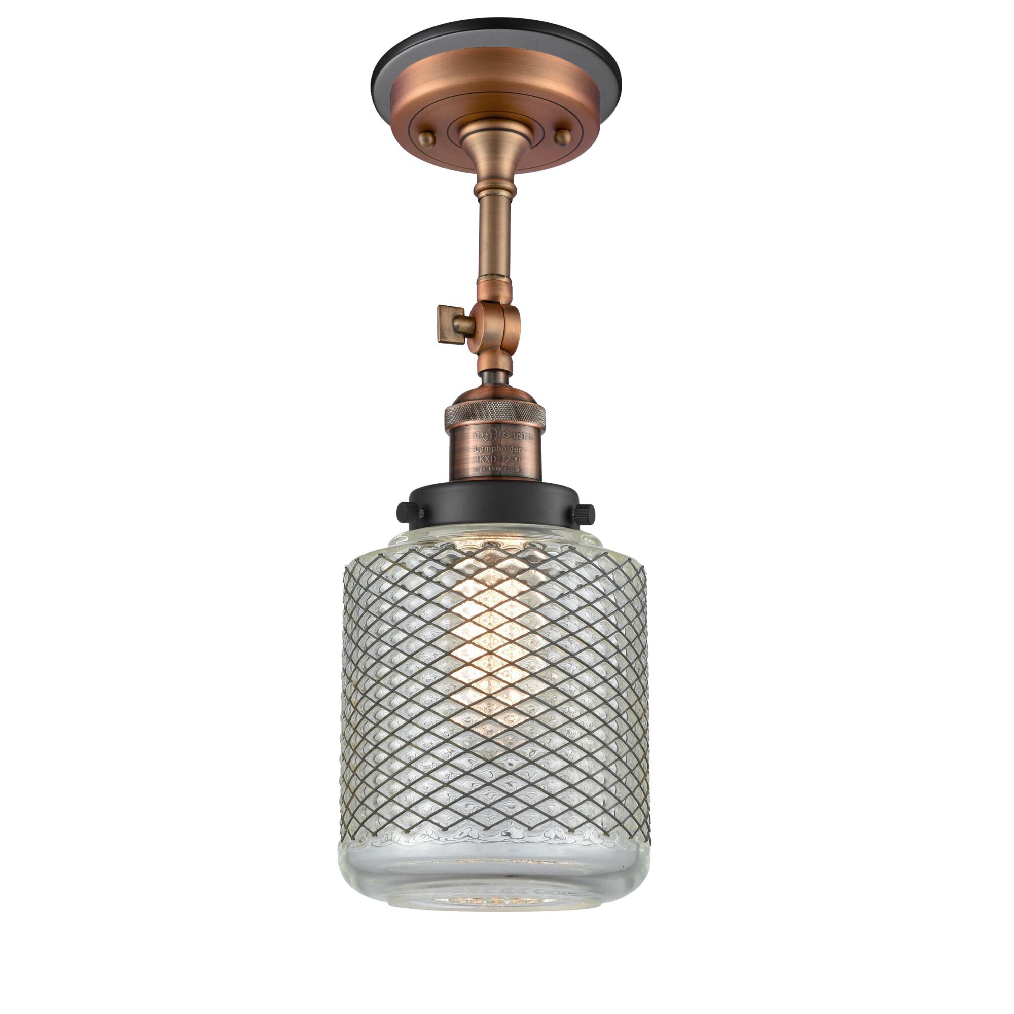 Shown in Antique Copper finish and Vintage Wire Mesh Stanton glass and Matte Black accent