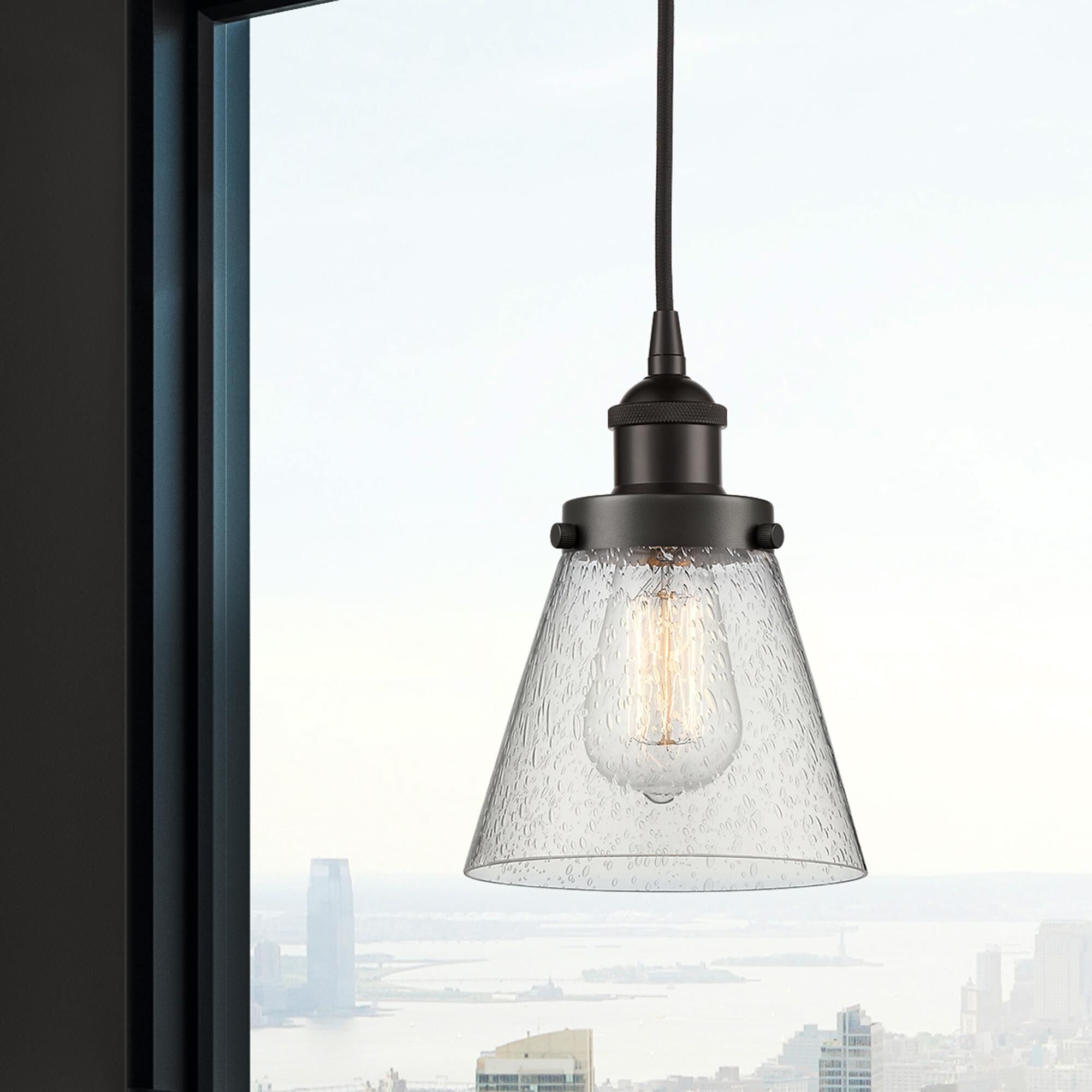 Shown in Oil Rubbed Bronze finish and Seedy Small Cone glass