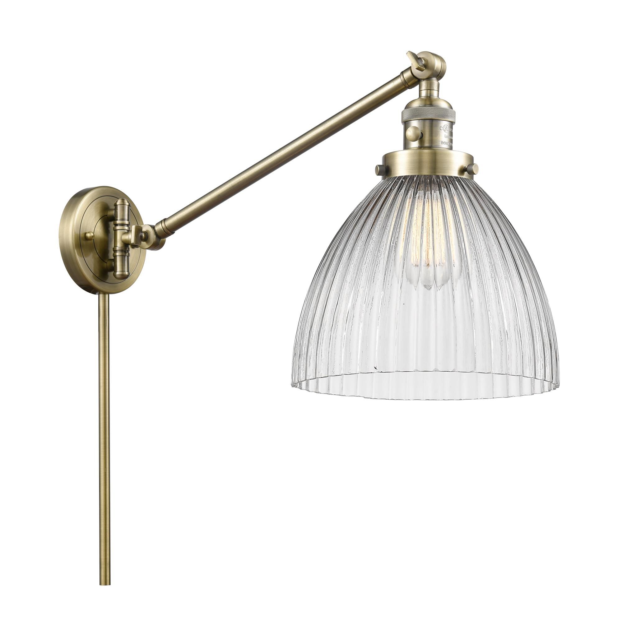 Shown in Antique Brass finish and Clear Halophane glass