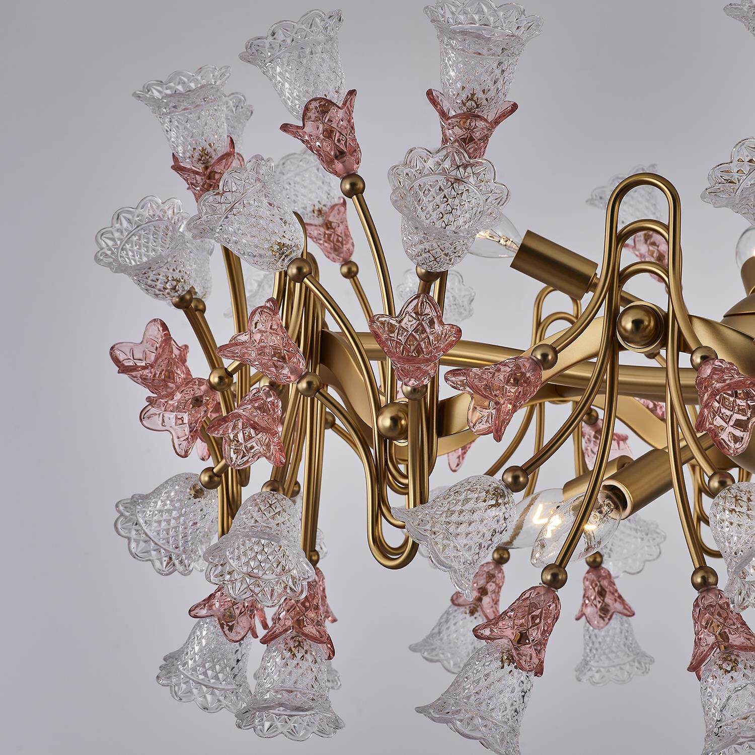 Shown in Antique Brass finish and Vintage Rose crystal