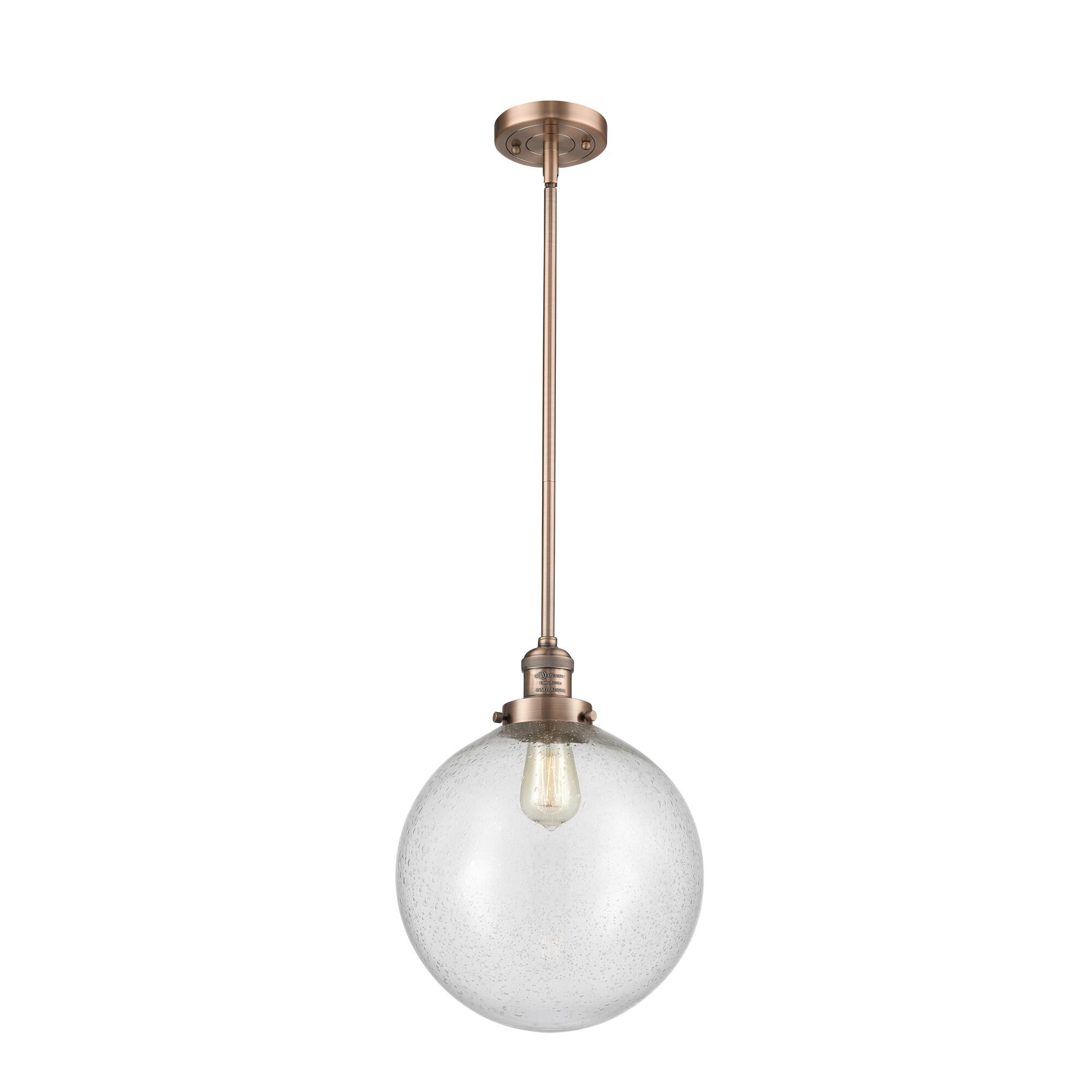 Shown in Antique Copper finish and Seedy Beacon glass