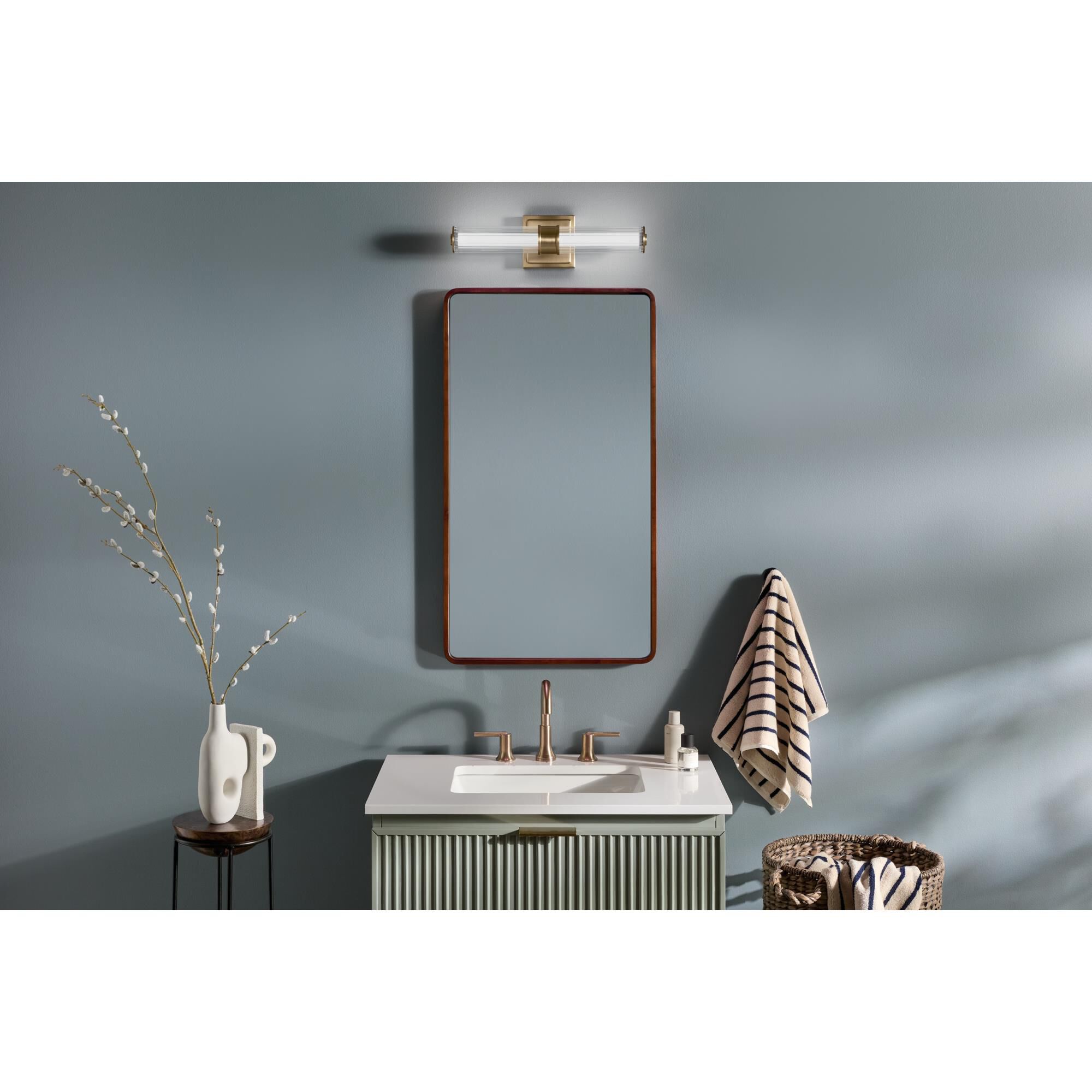 Shown in Champagne Bronze finish and Clear Fluted glass