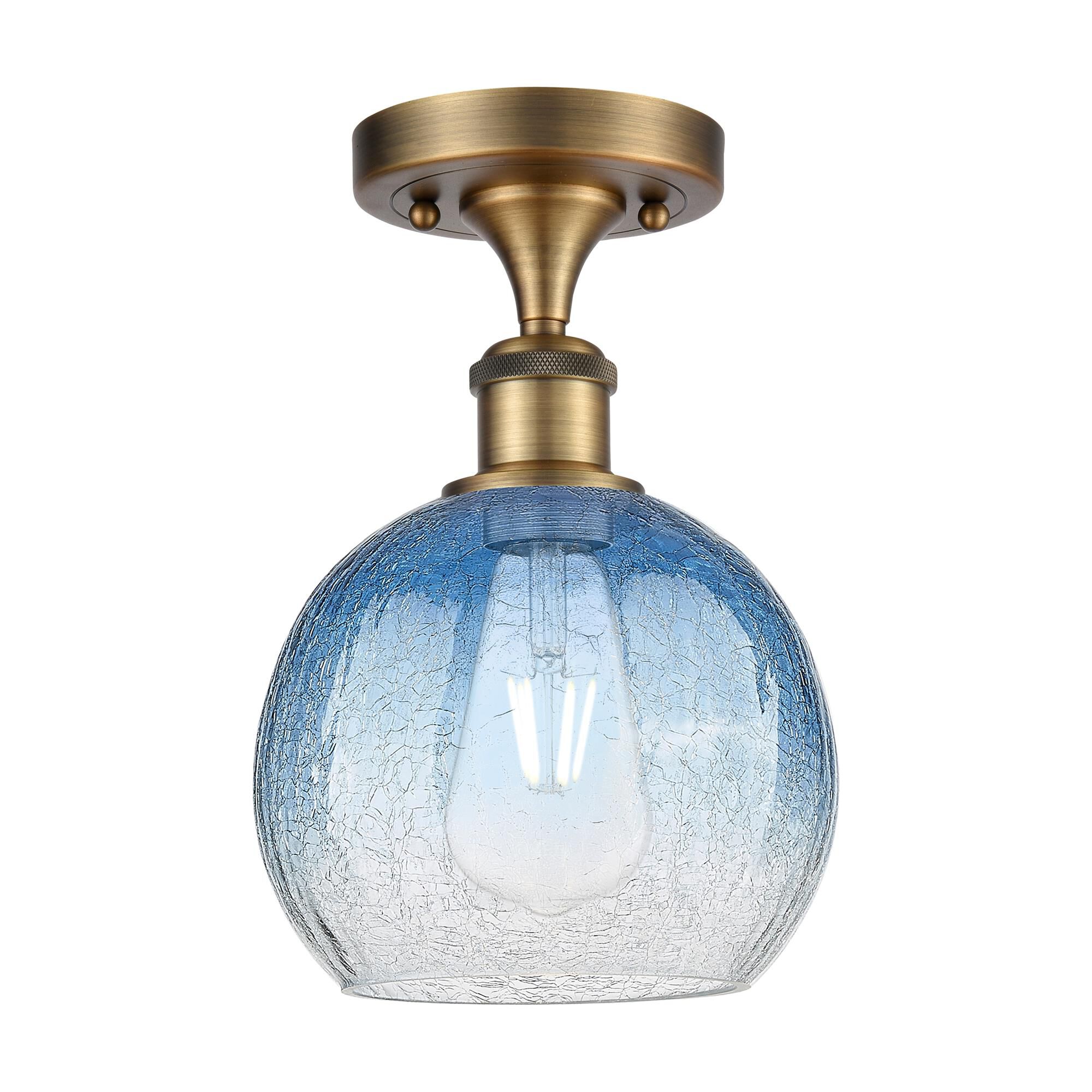Shown in Brushed Brass finish and Sapphire Blue glass