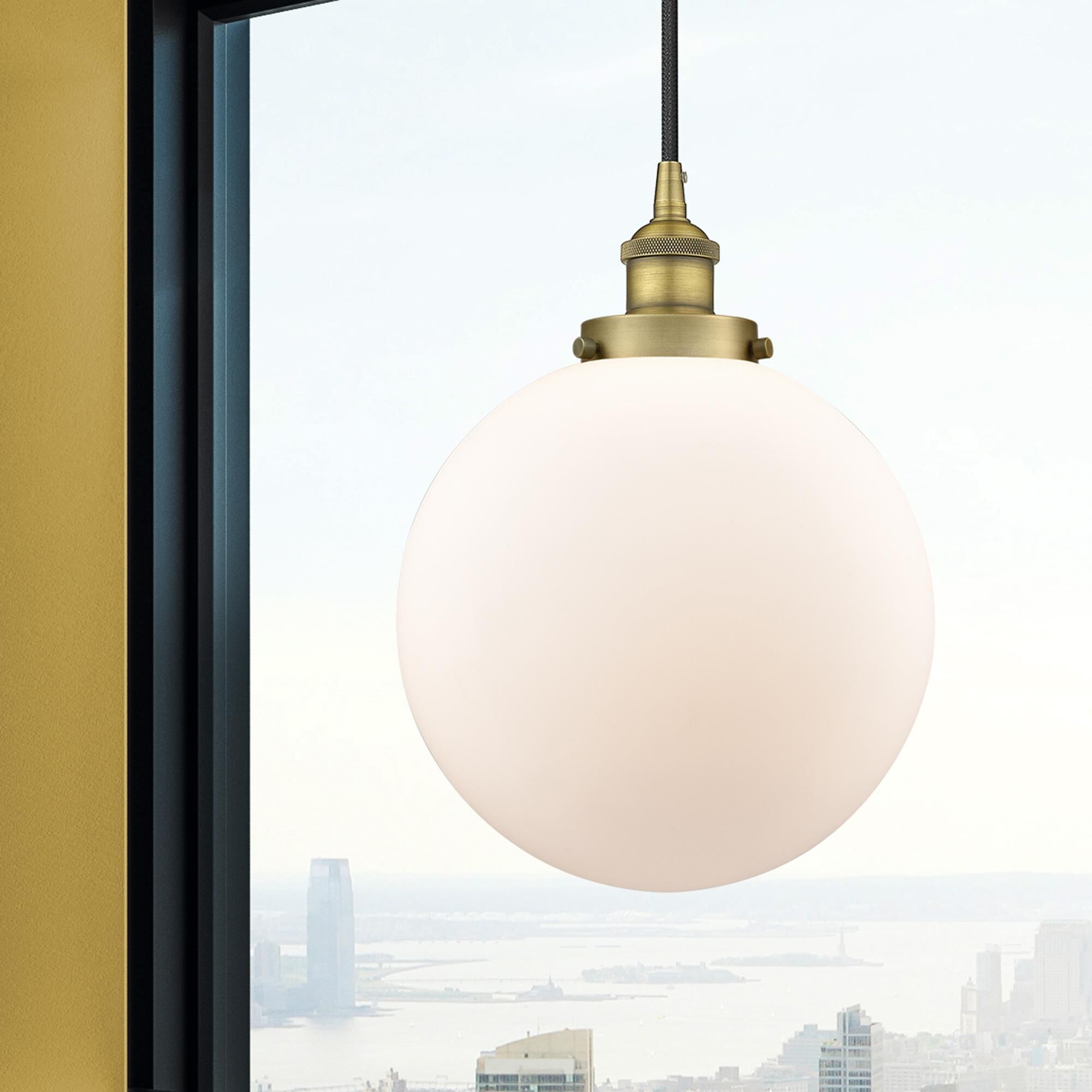 Shown in Brushed Brass finish and Matte White Cased Beacon glass