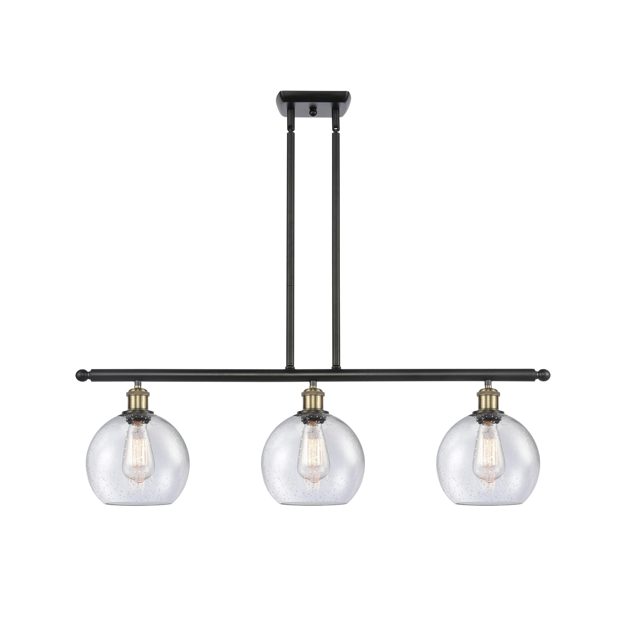Shown in Black Antique Brass finish and Seedy Athens glass
