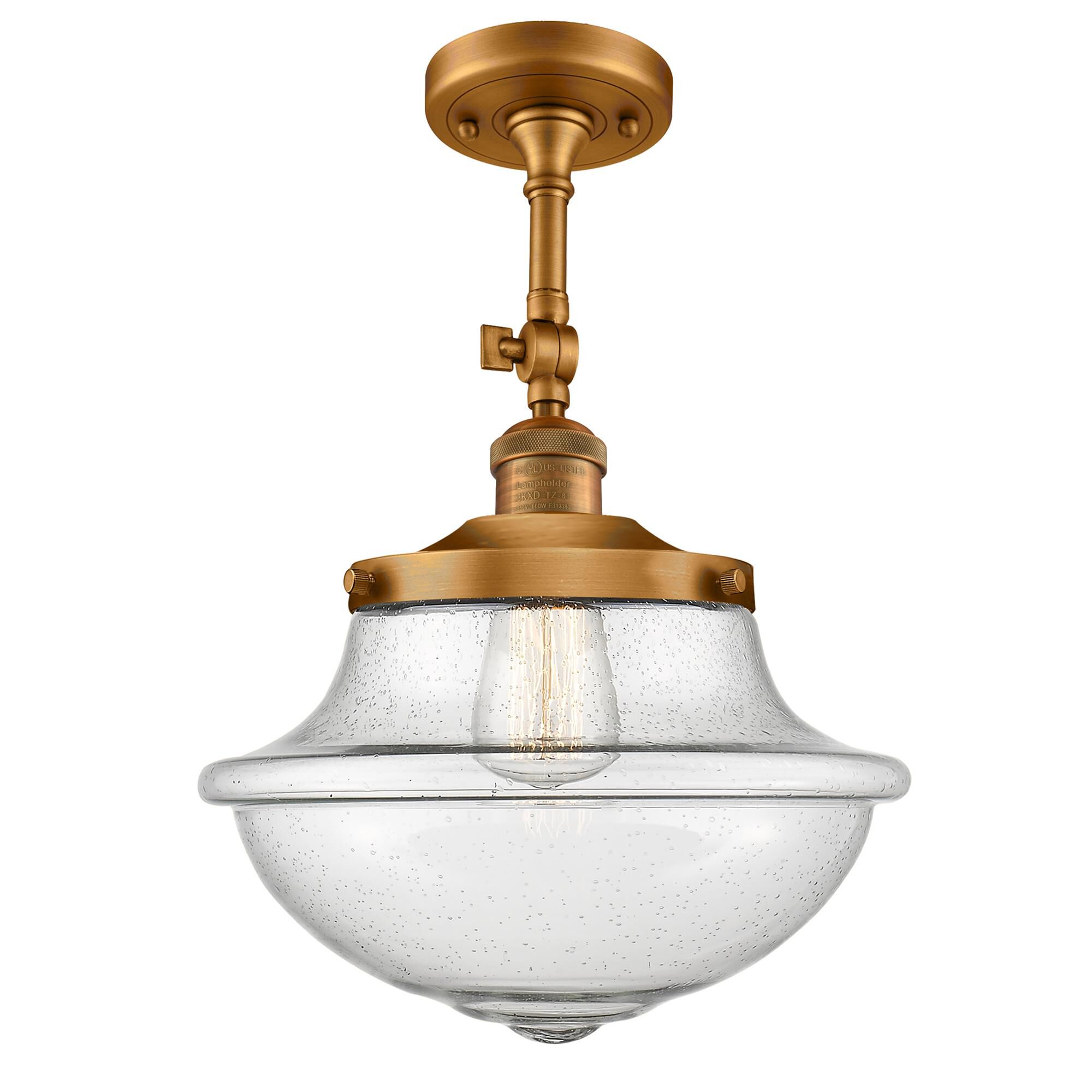 Shown in Brushed Brass finish and Seedy glass