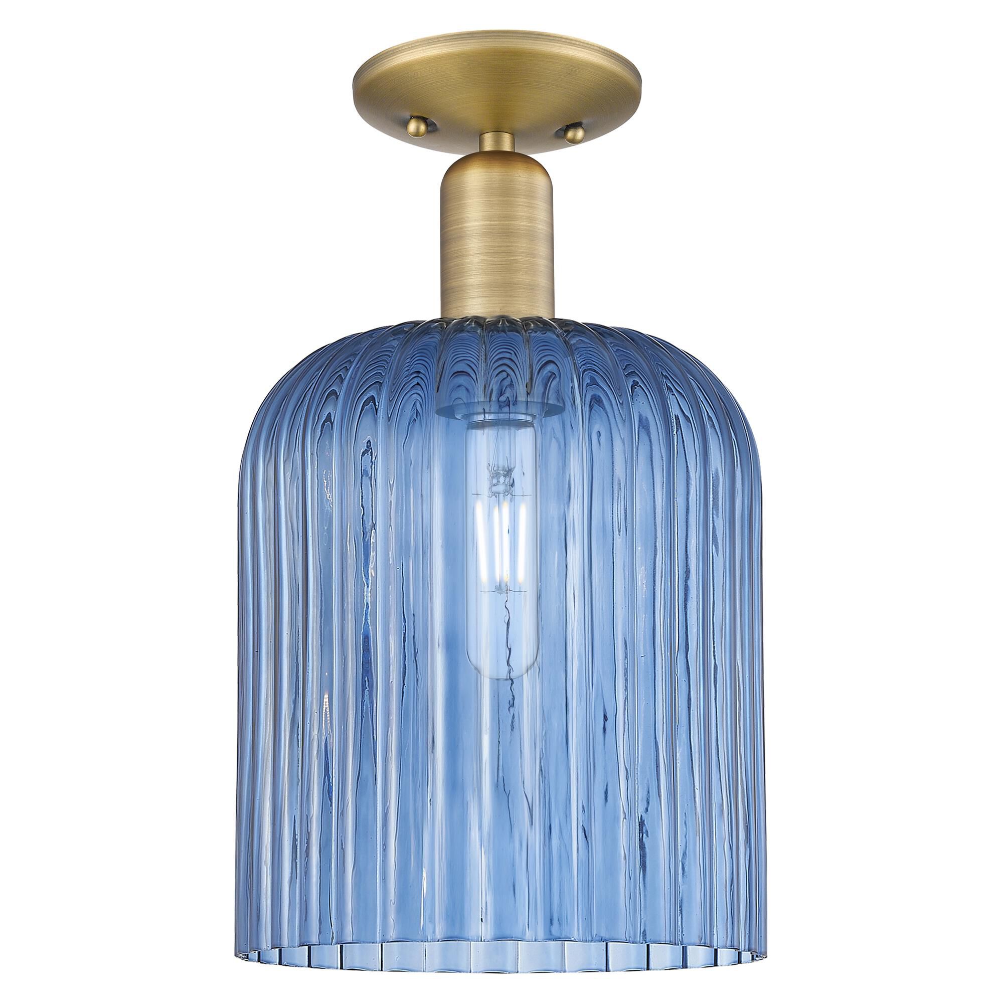 Shown in Brushed Brass finish and Blue glass
