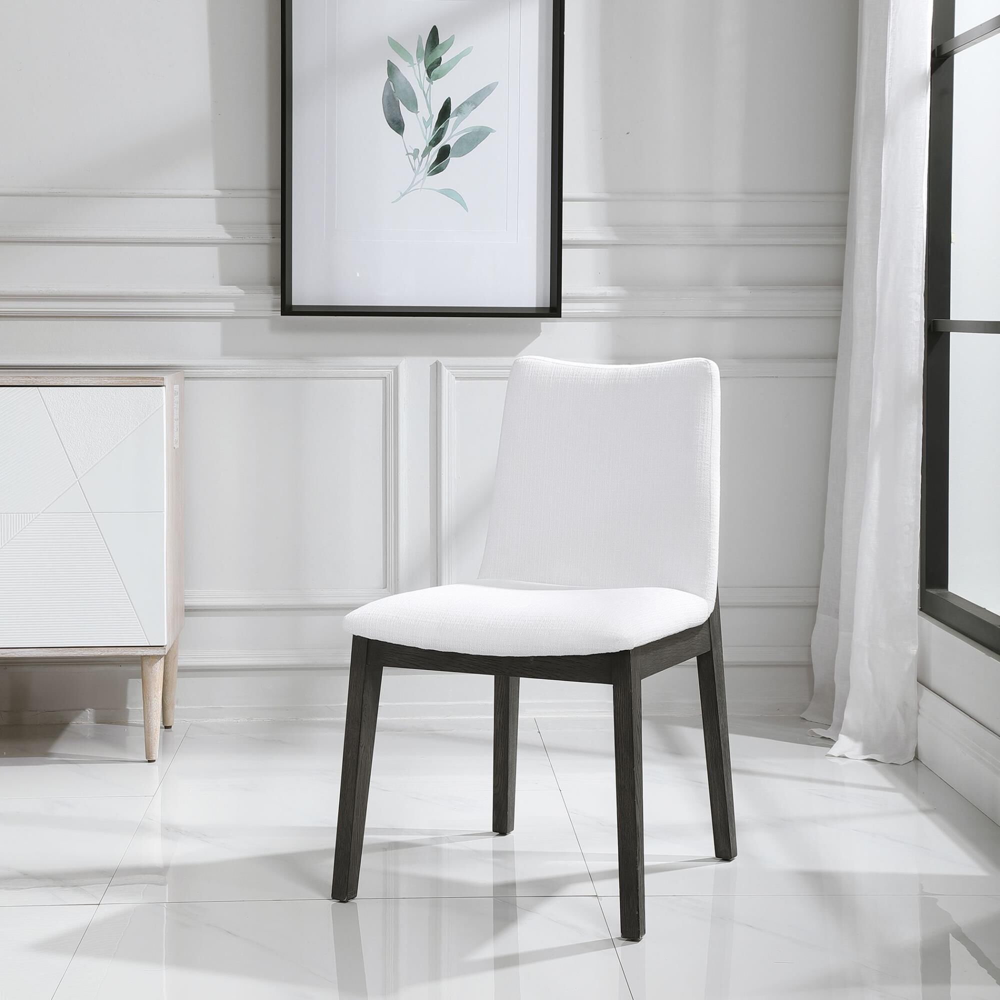 Shown in Gently Sloped Padded Seat In A Crisp White Polyester Blend Fabric Rests Within A Solid Oak Wood Fram finish